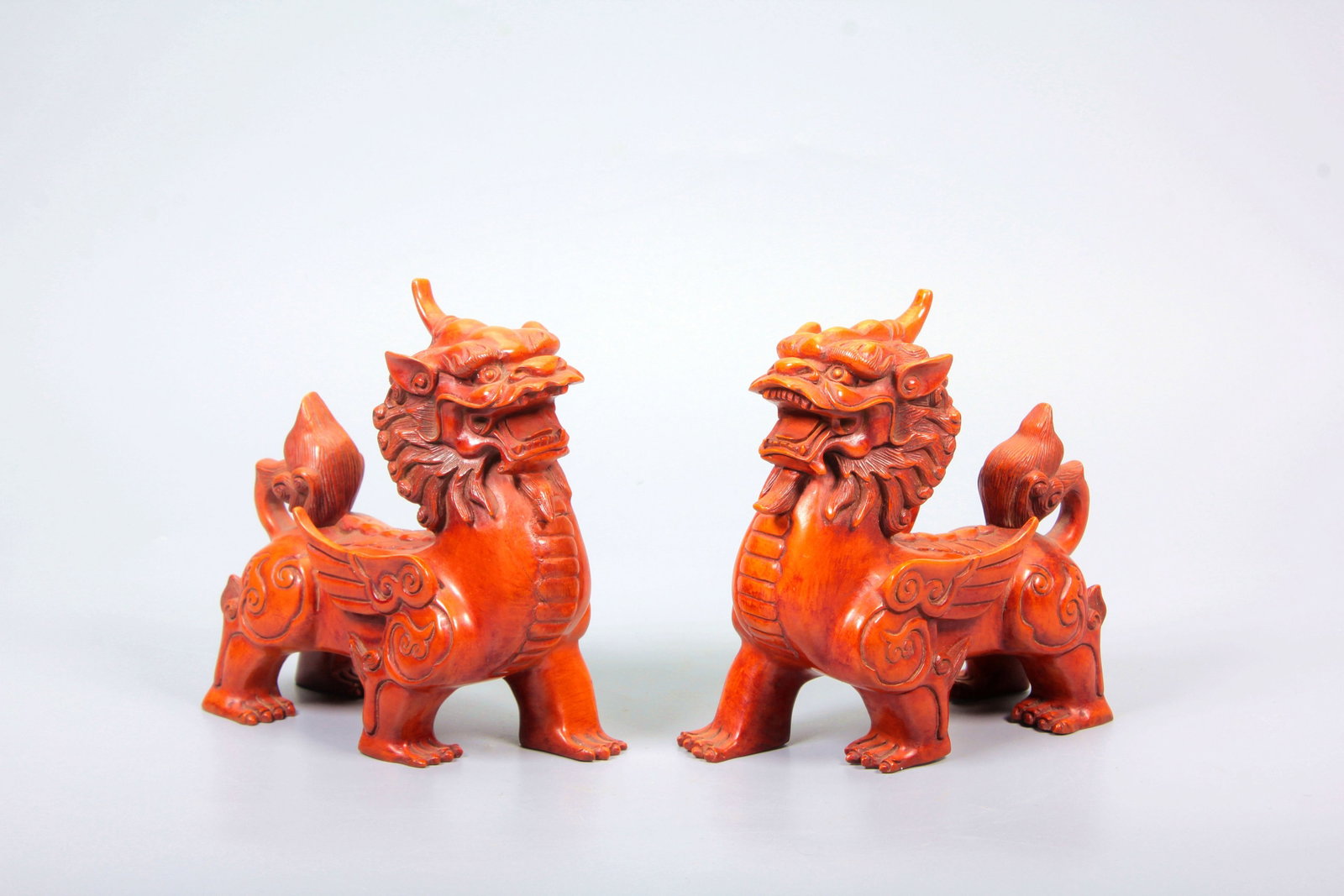 A BOXWOOD CARVED KIRIN FIGURE PAIR: A BOXWOOD CARVED KIRIN FIGURE PAIR 1.H:11.3CM,L:5CM,W:10.9CM;2.H:11.1CM,L:4.8CM,W:10.7CM