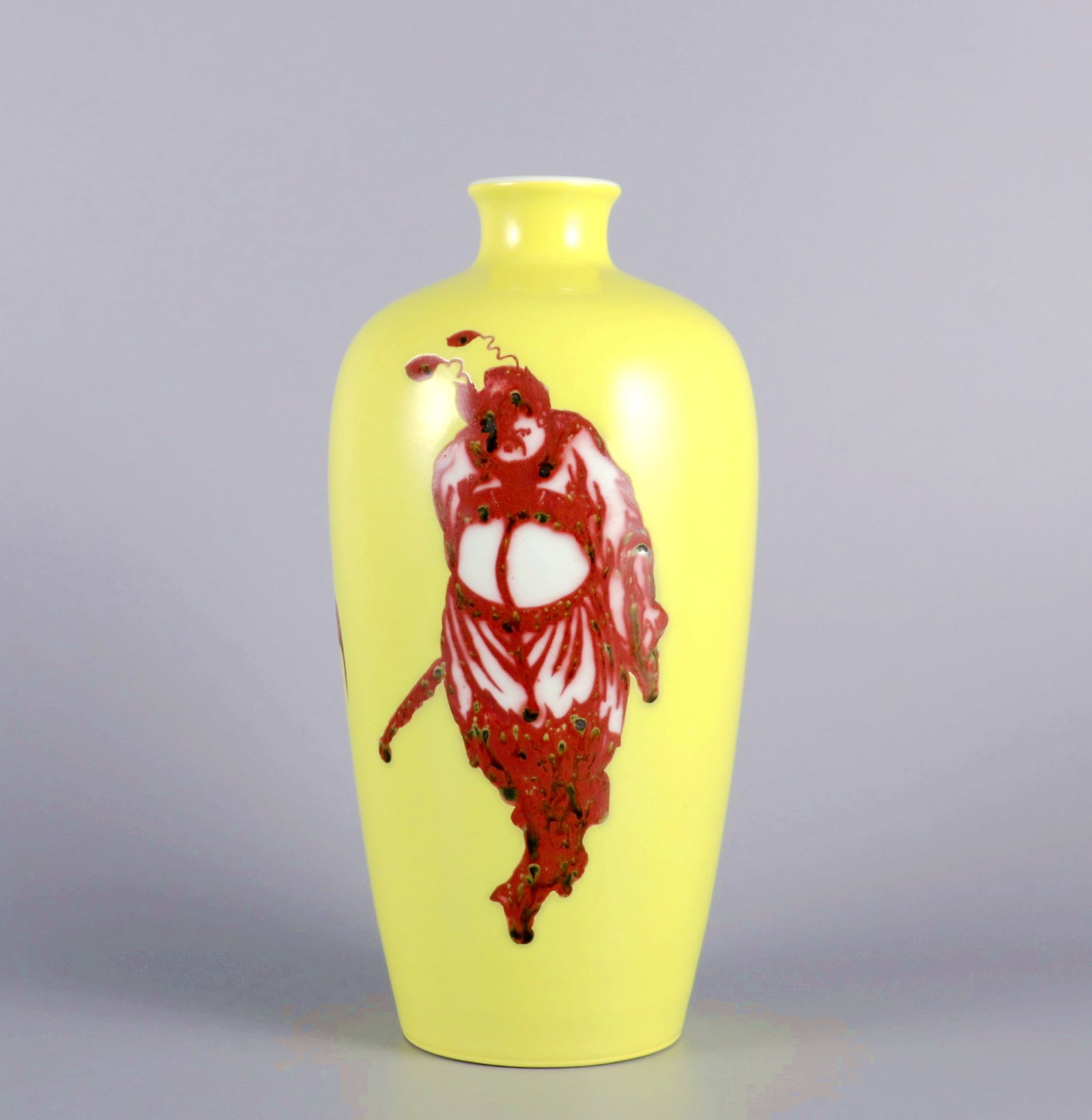 A YELLOW GROUND UNDERGLAZED RED ZHONG KUI PRUNUS VASE: A YELLOW GROUND UNDERGLAZED RED ZHONG KUI PRUNUS VASE H:23.6CM,D:11.5CM