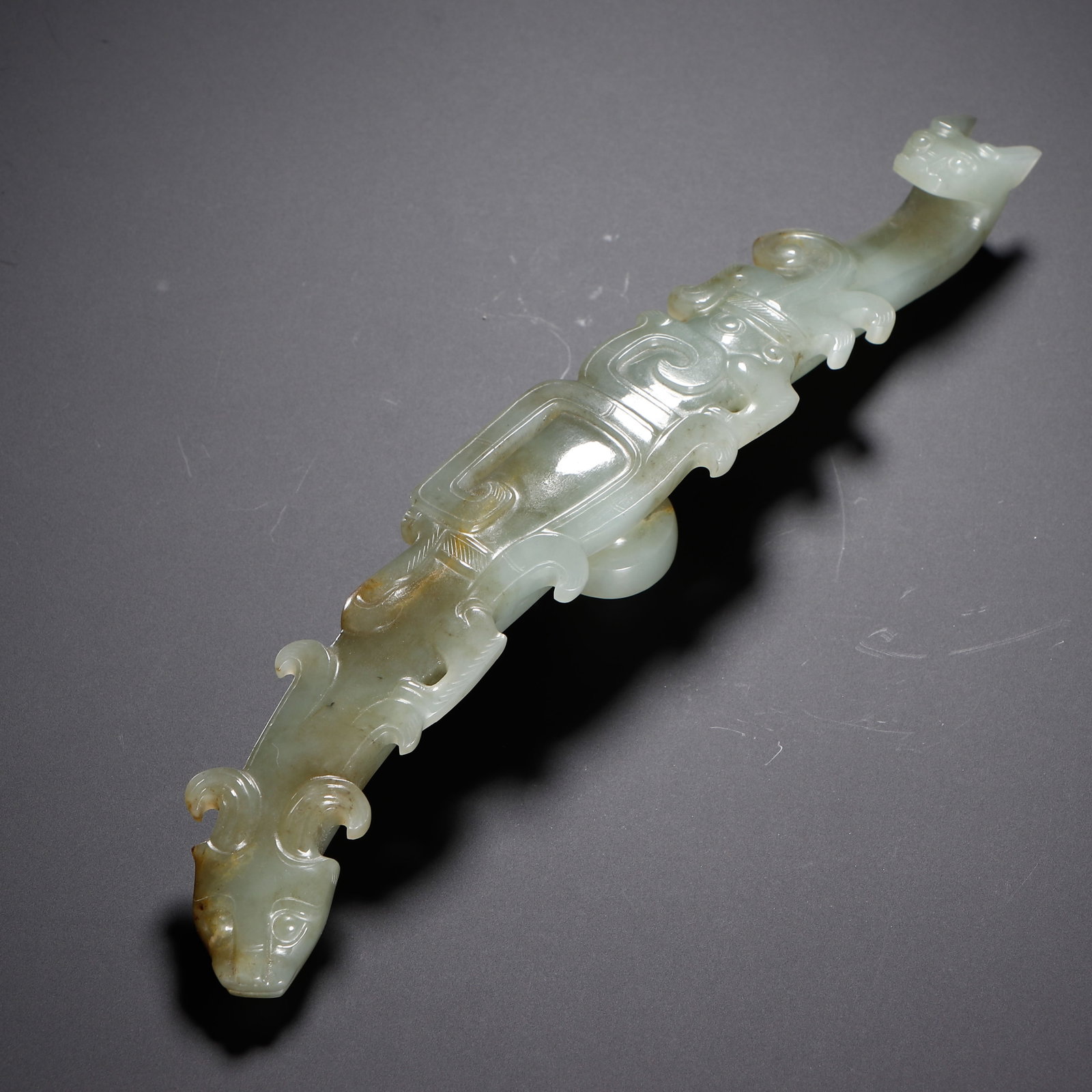 A Chinese Hetian Jade Belt Hook with Dragon Motif: A Chinese Hetian Jade Belt Hook with Dragon Motif (19 x 3cm,Weight 100g)
