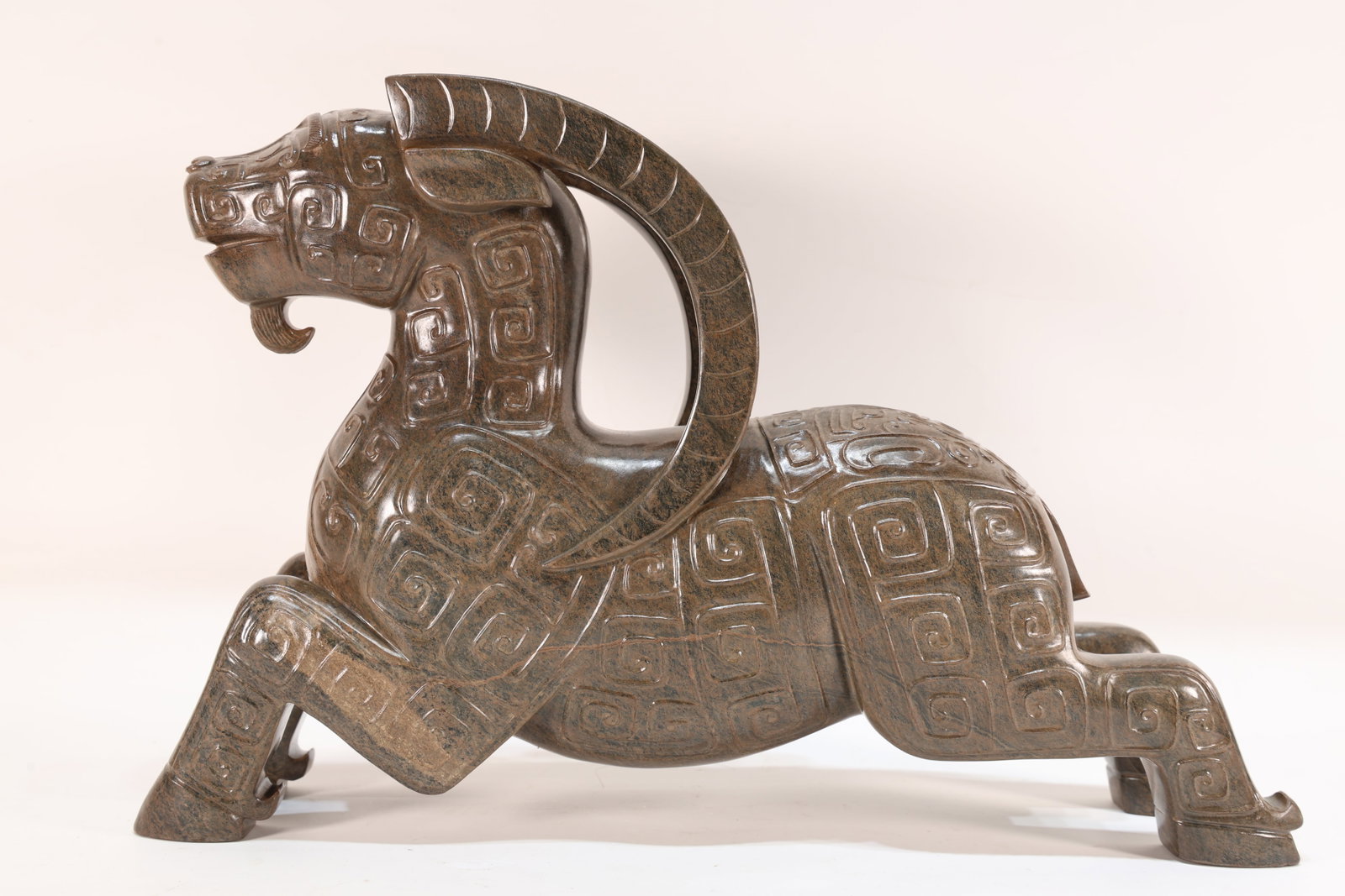 A Jade Carved Beast Face Pattern Ram Shape Figure: A Jade Carved Beast Face Pattern Ram Shape Figure (33.5 x 22 x 8.5cm)