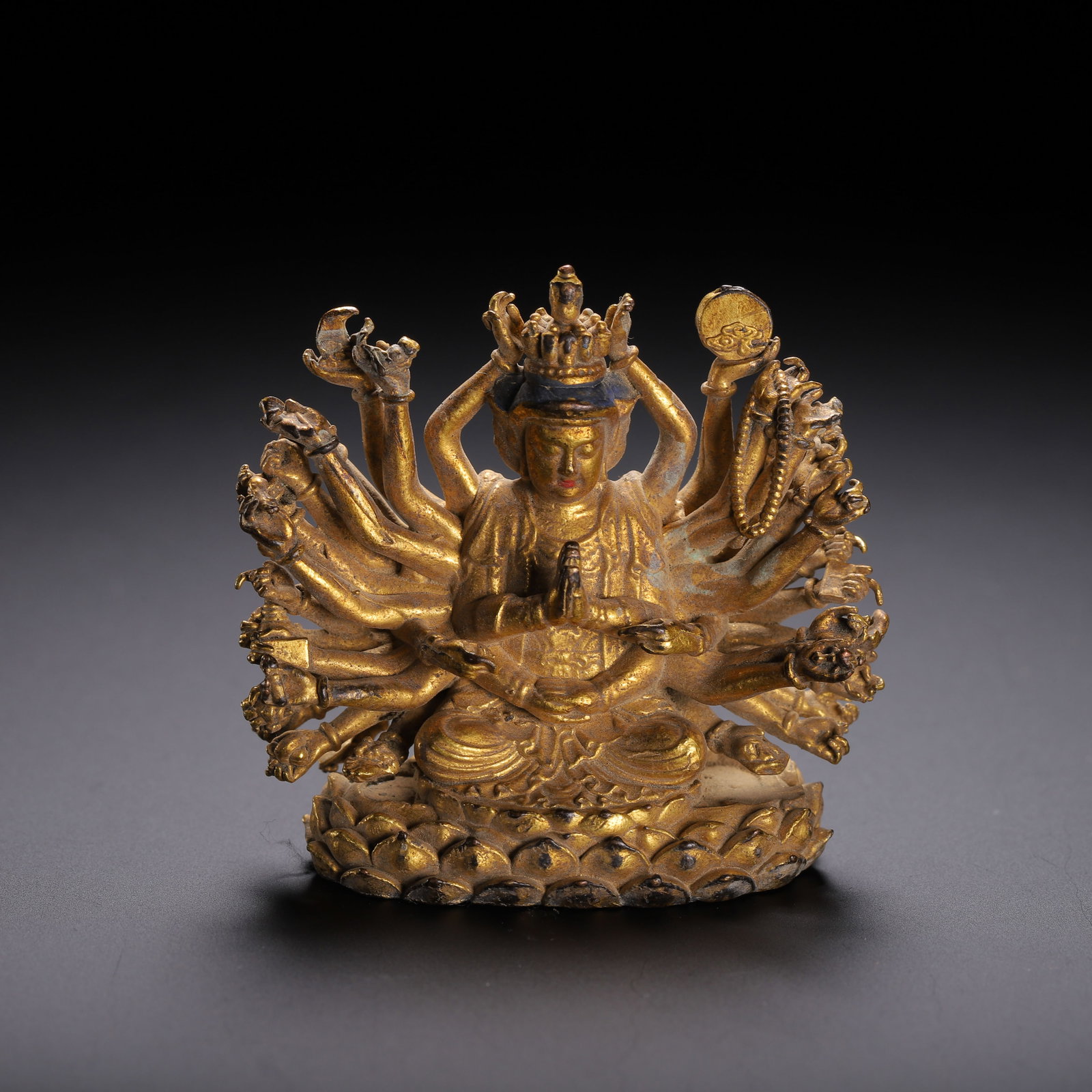 A Chinese Gilt Bronze Multi-Armed Guanyin Statue (1 of 9)