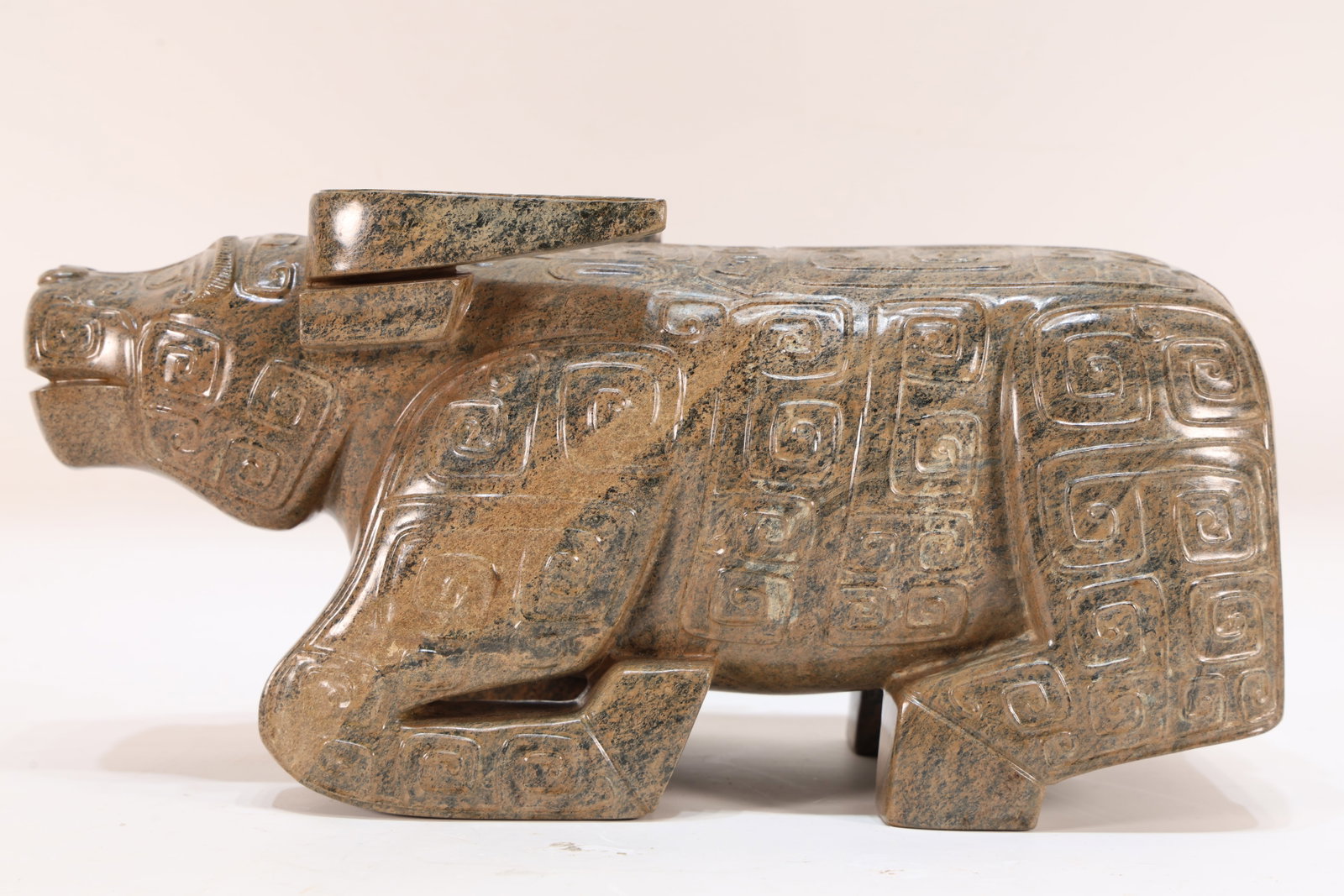 A Jade Carved Beast Face Pattern Ox Shape Figure: A Jade Carved Beast Face Pattern Ox Shape Figure (29 x 14 x 10.5cm)