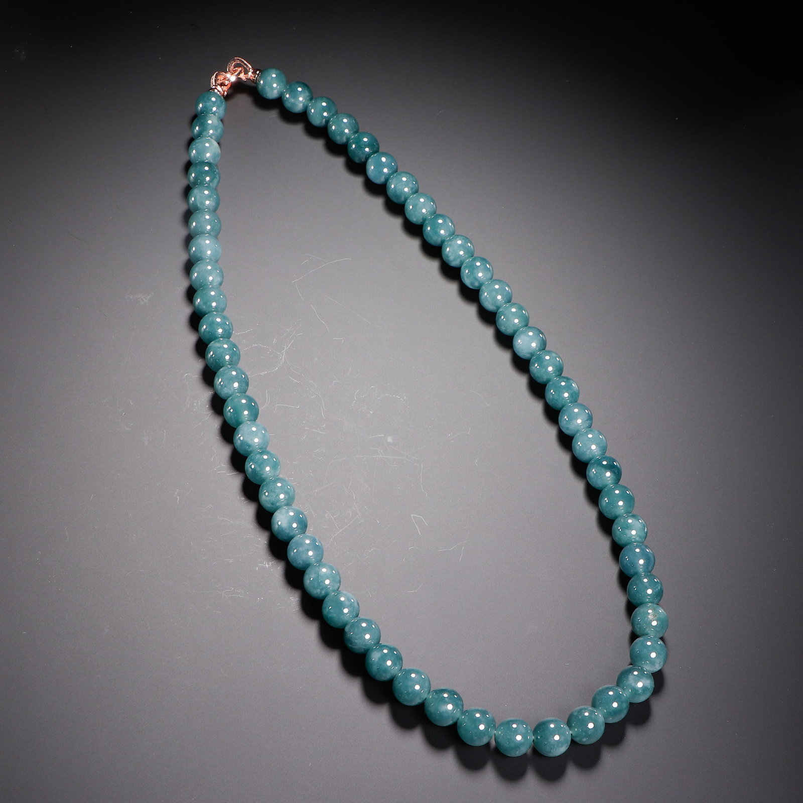 A Chinese Jadeite Beaded Necklace: A Chinese Jadeite Beaded Necklace (1.2 x 1.2cm)