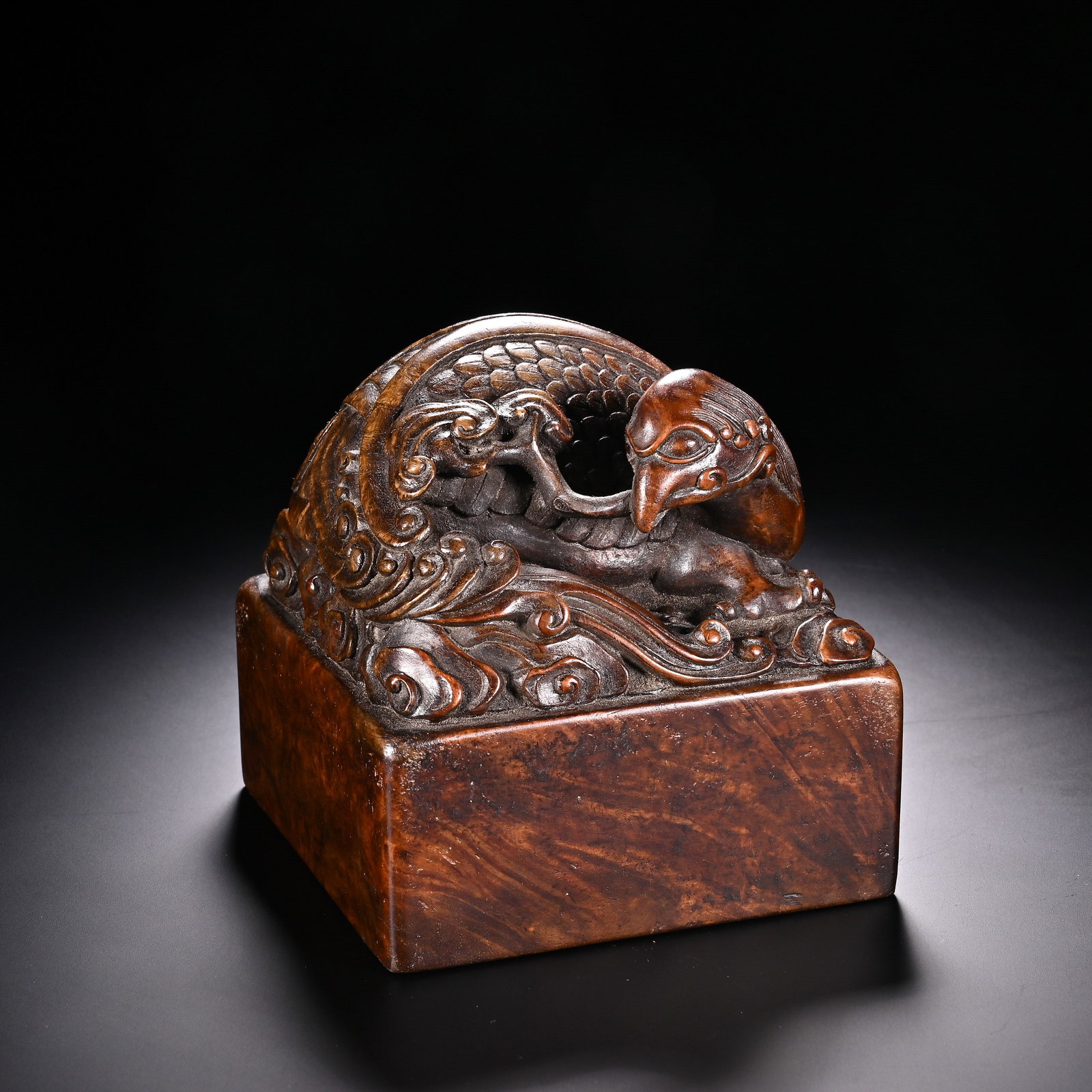 A Chinese Huanghuali Wood Phoenix Seal: A Chinese Huanghuali Wood Phoenix Seal (9.7 x 9.8cm)
