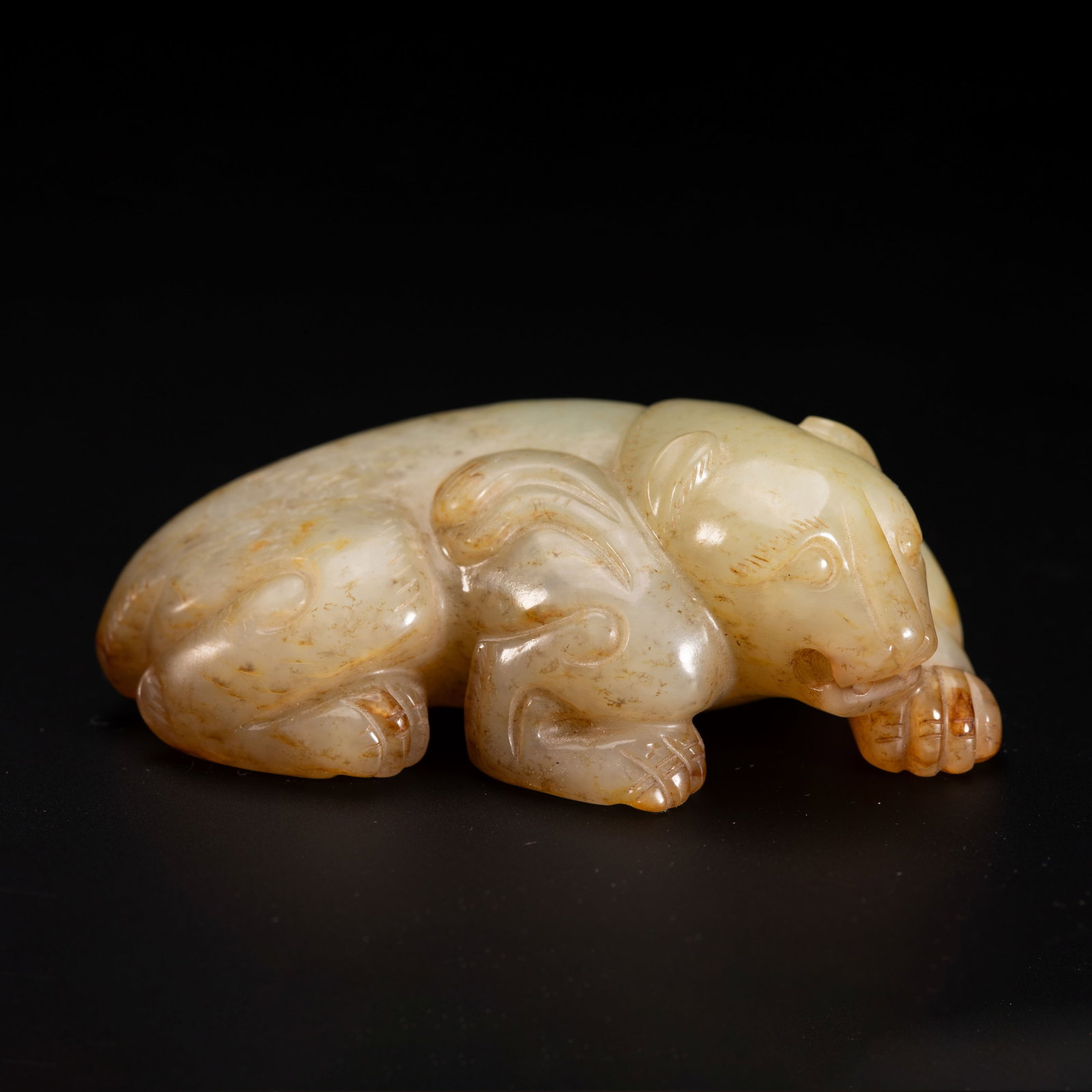A Chinese Hetian Jade Recumbent Mythical Beast Carving: A Chinese Hetian Jade Recumbent Mythical Beast Carving (6.5 x 3.5 x 2cm,Weight 70g)