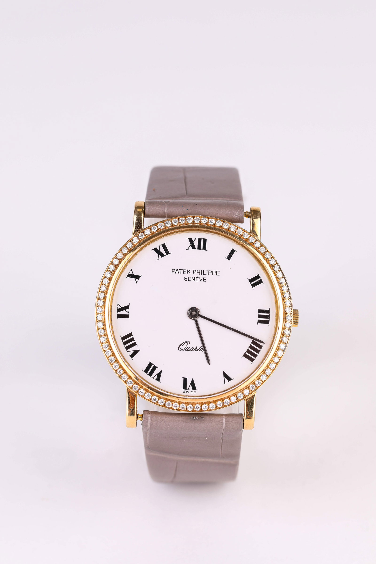 A Patek Philippe Gold and Diamond Wristwatch: Dimensions: Width: 34 mm. All measurements are approximate.