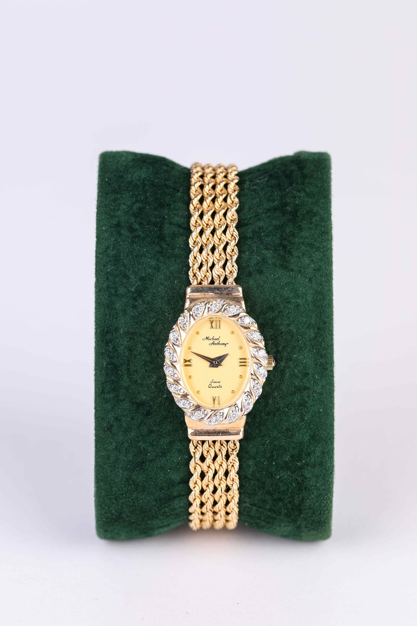 A Michael Anthony Gemstone and Gold Pocket Watch: Dimensions: Width: 21 mm x Height: 29 mm. All measurements are approximate.