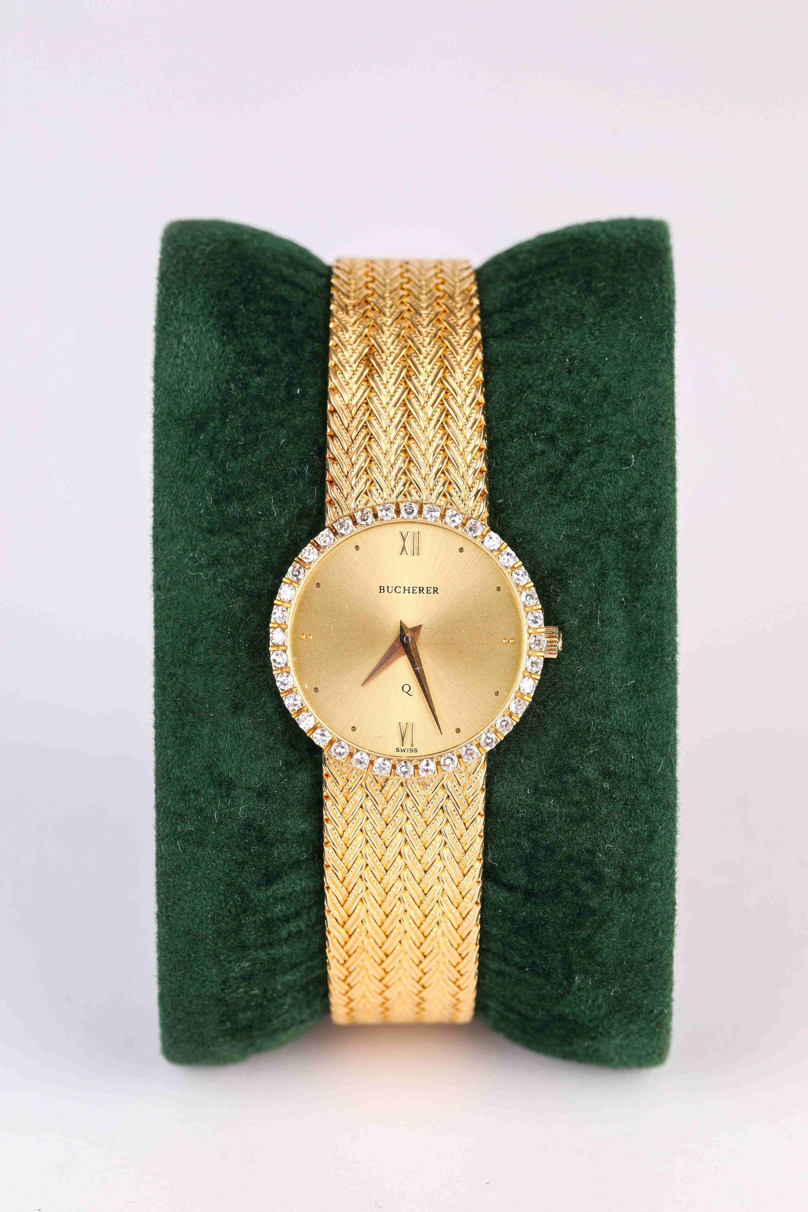 A Carl F. Bucherer Gold Wristwatch: Dimensions: Width: 25 mm. All measurements are approximate.