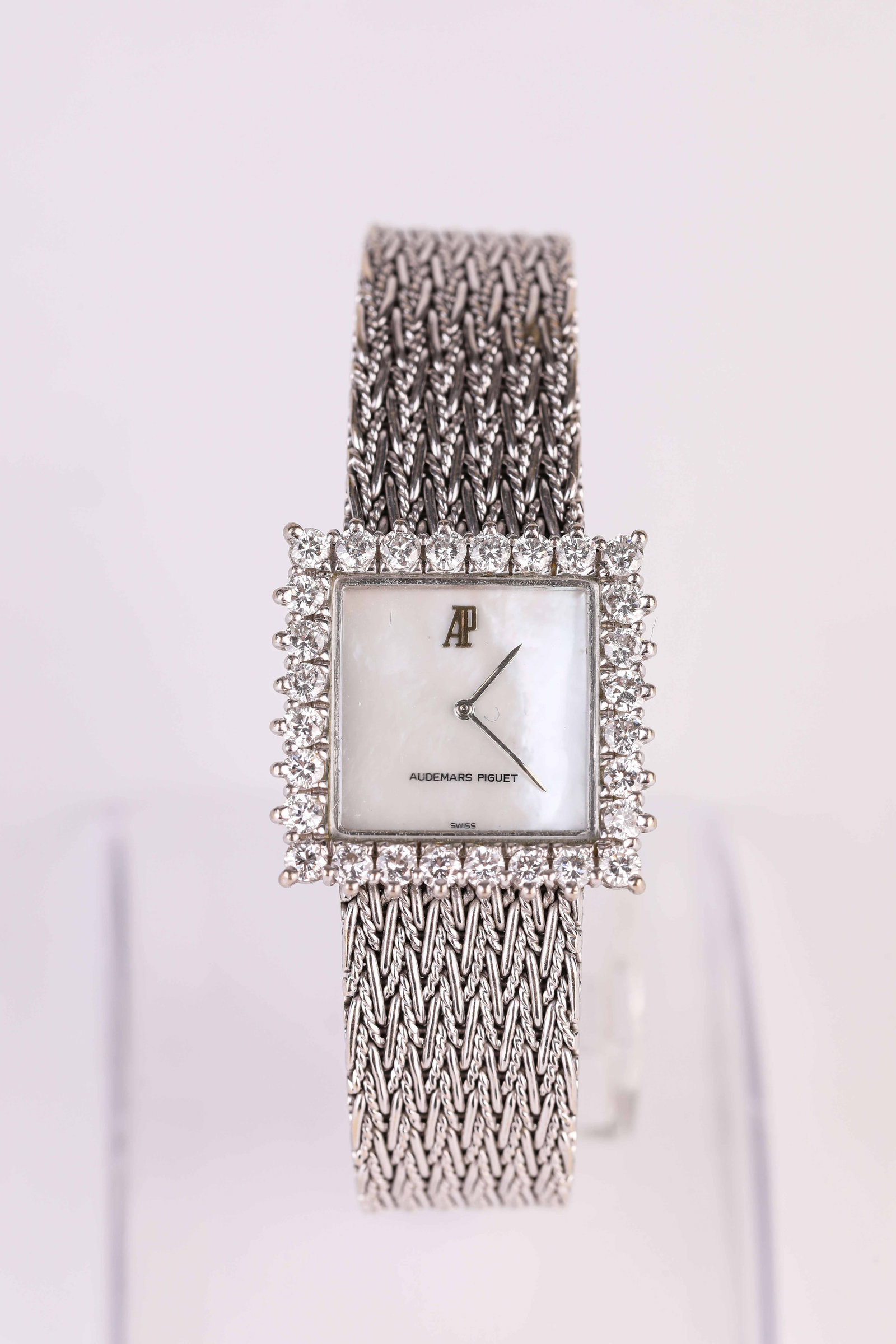An Audemars Piguet Gold and Diamond Wristwatch: Dimensions: Width: 23 mm. All measurements are approximate.