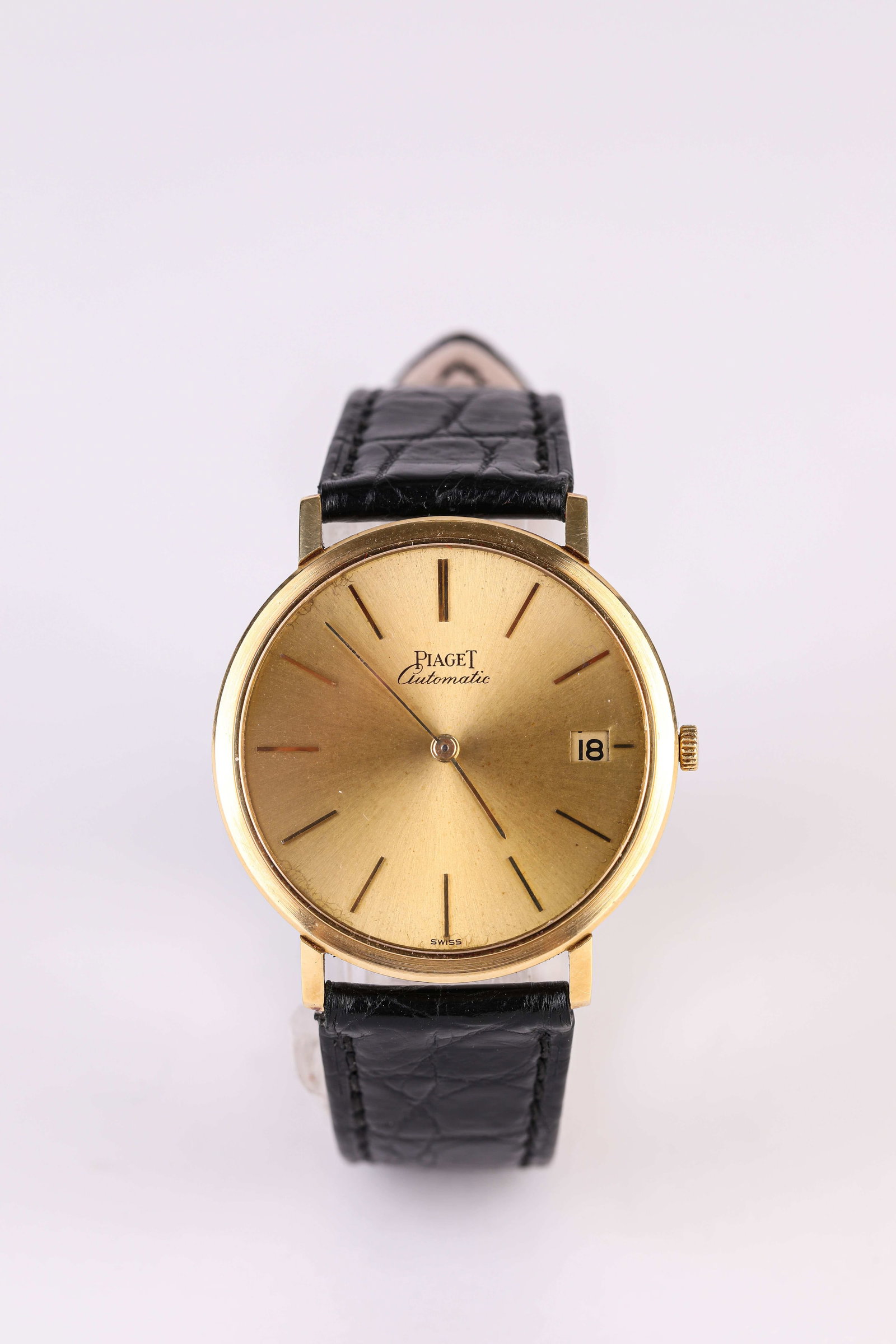 A Piaget Gold Wristwatch: Dimensions: Width: 34 mm. All measurements are approximate.