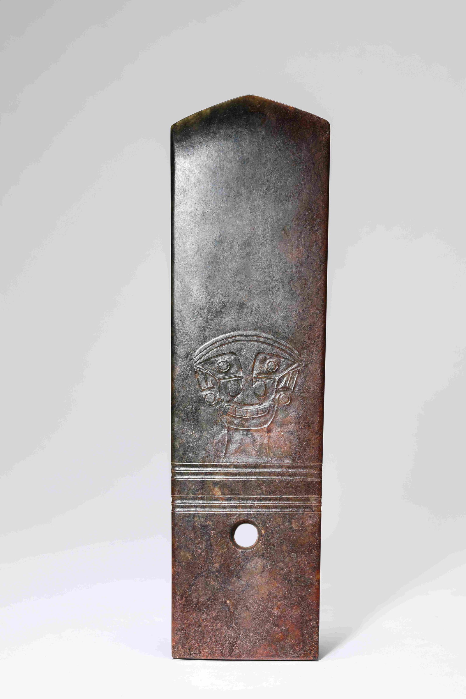 A Jade 'Gui' Tablet: Dimensions: Width: 7.9 cm x Height: 27.5 cm. All measurements are approximate.