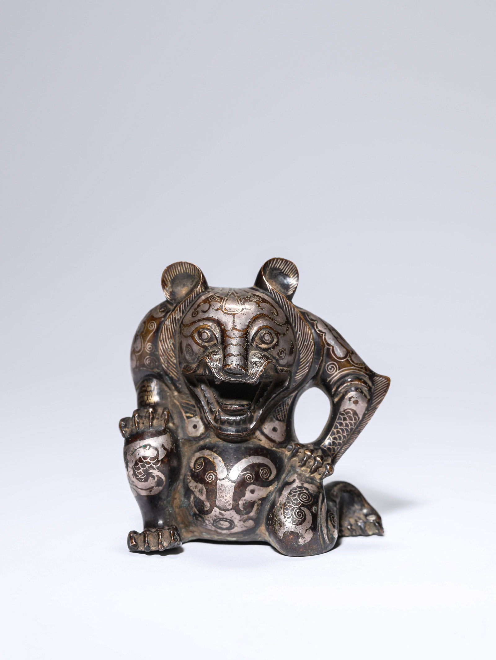 A Gold and Silver-Inlaid Bronze Bear: Dimensions: Weight: 267 g. Length: 7.8 cm x Width: 4.6 cm x Height: 8.1 cm. All measurements are approximate.