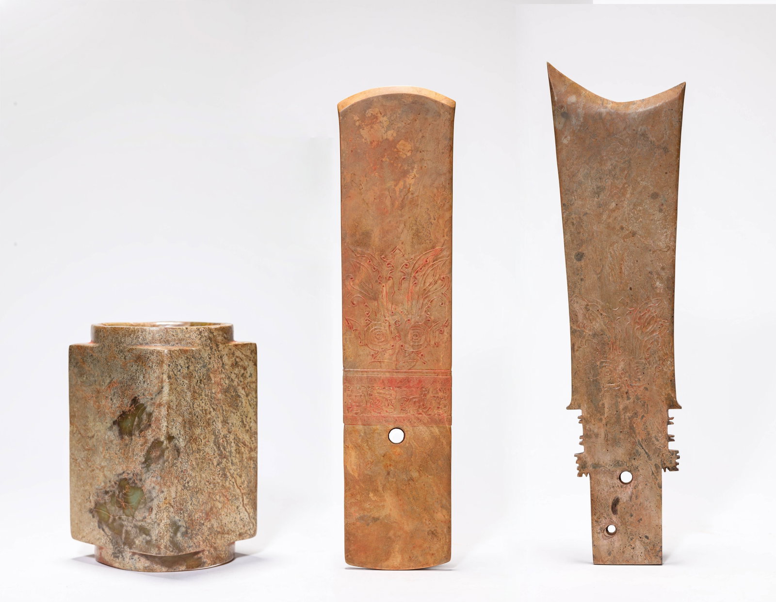A Group of Jade 'Yazhang', 'Gui' and 'Cong': Dimensions: Width: 10.7 cm x Height: 40 cm. Width: 9 cm x Height: 37 cm. Width: 8.4 cm x Height: 14.3 cm. All measurements are approximate.