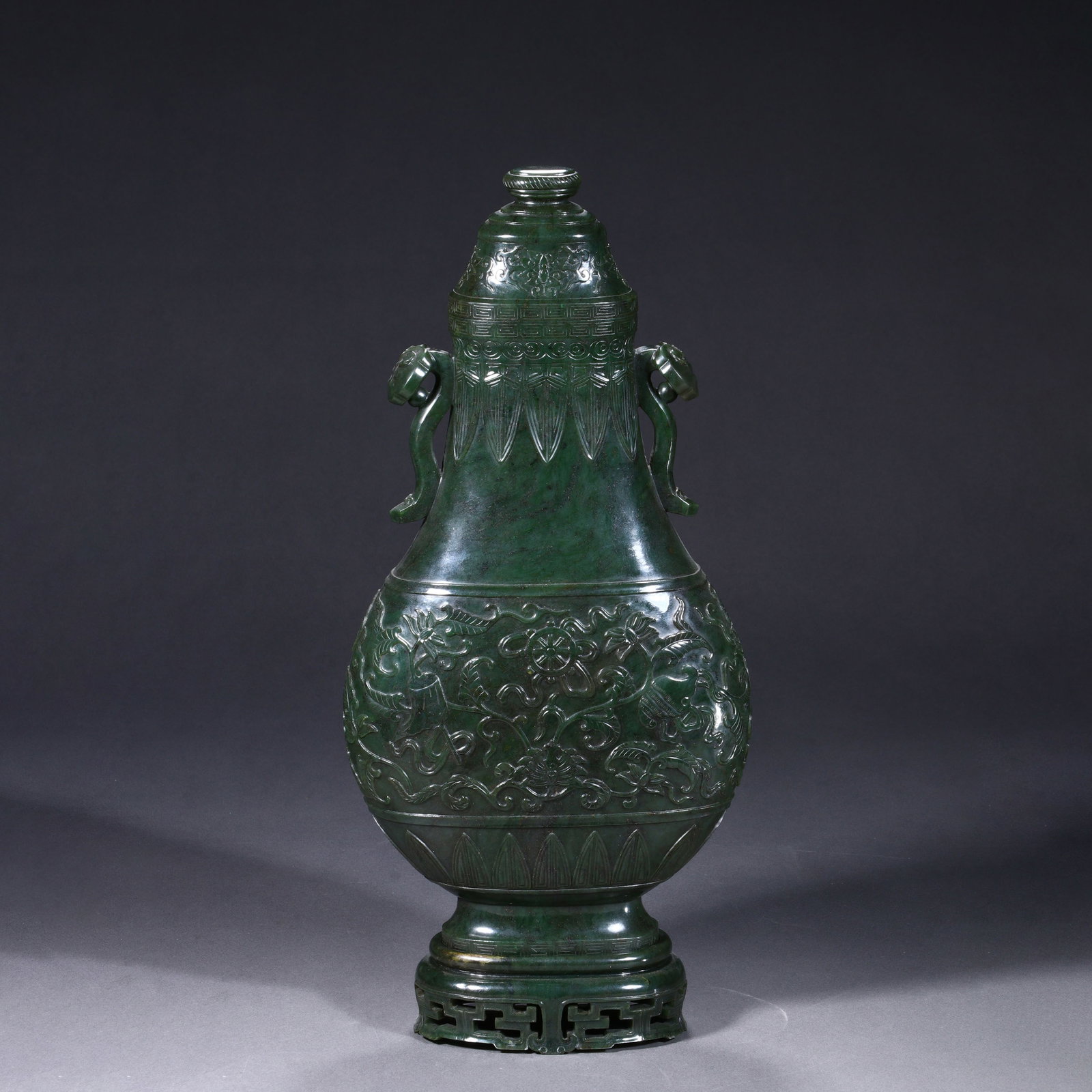Carved green jade double-eared bottle: Carved green jade double-eared bottle Height:38cm Width:18cm