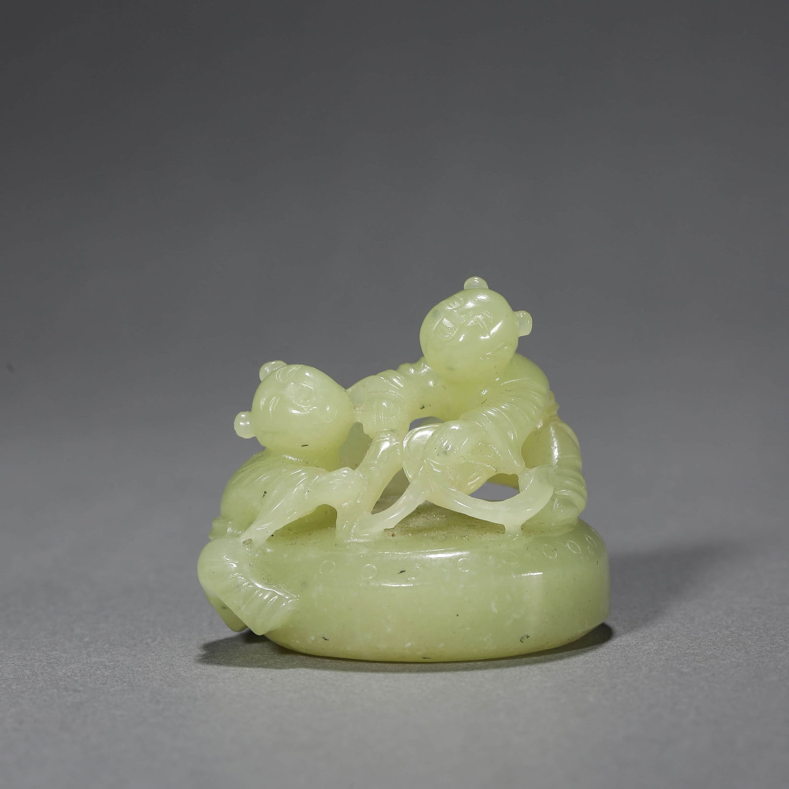 Yellow Jade Ornament of a Child Beating Drum: Yellow Jade Ornament of a Child Beating Drum Length:5.2cm Width:4.3cm Height:4.3cm