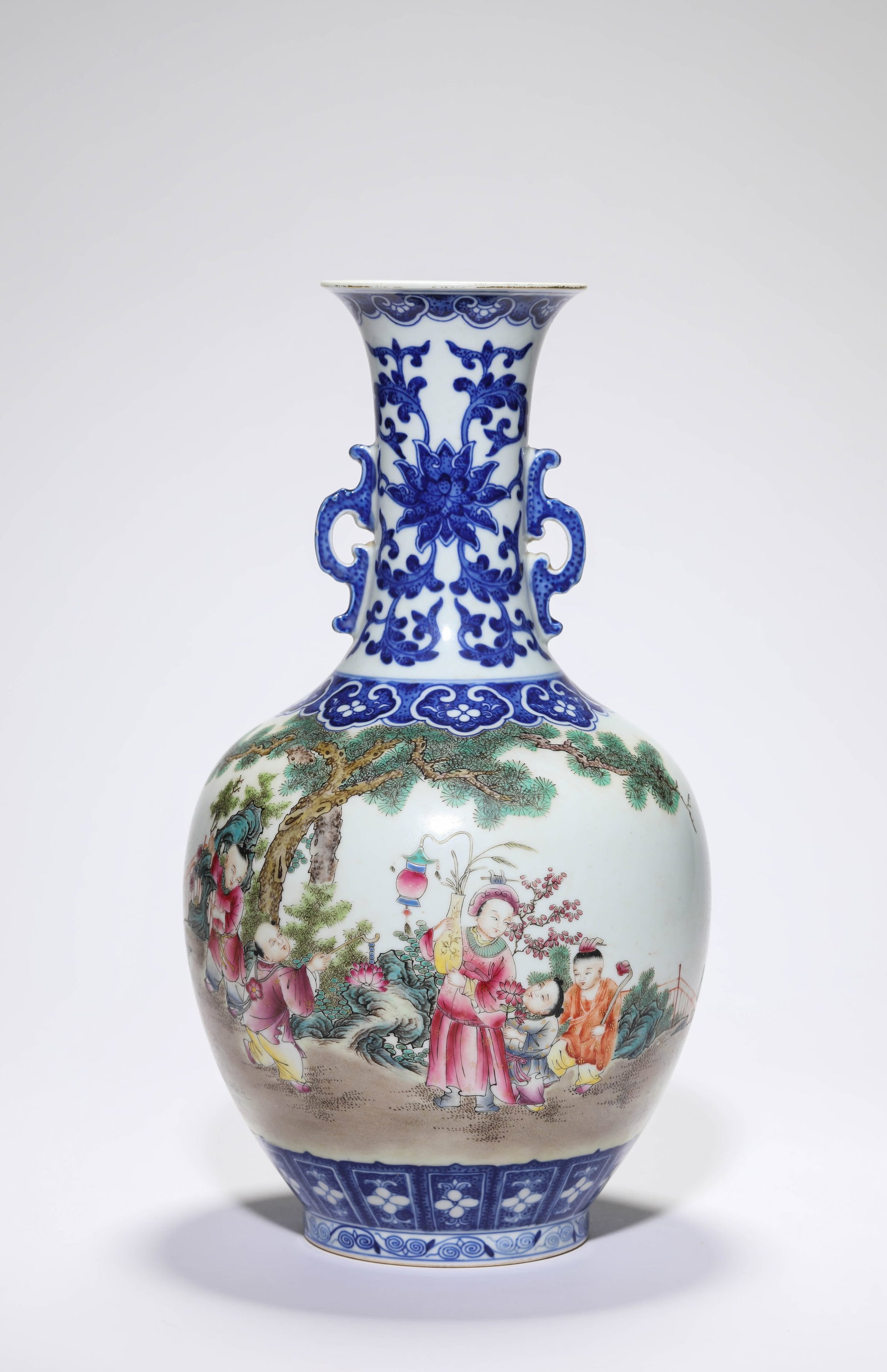 A BLUE AND WHITE AND FAMILLE-ROSE ?CHILDREN AT PLAY? ?DOUBLE-HANDLED? ?REWARD? VASE: A BLUE AND WHITE AND FAMILLE-ROSE ?CHILDREN AT PLAY? ?DOUBLE-HANDLED? ?REWARD? VASE Description: Dimensions: Width: 18.2 cm x Height: 33.4 cm. All measurements are approximate.