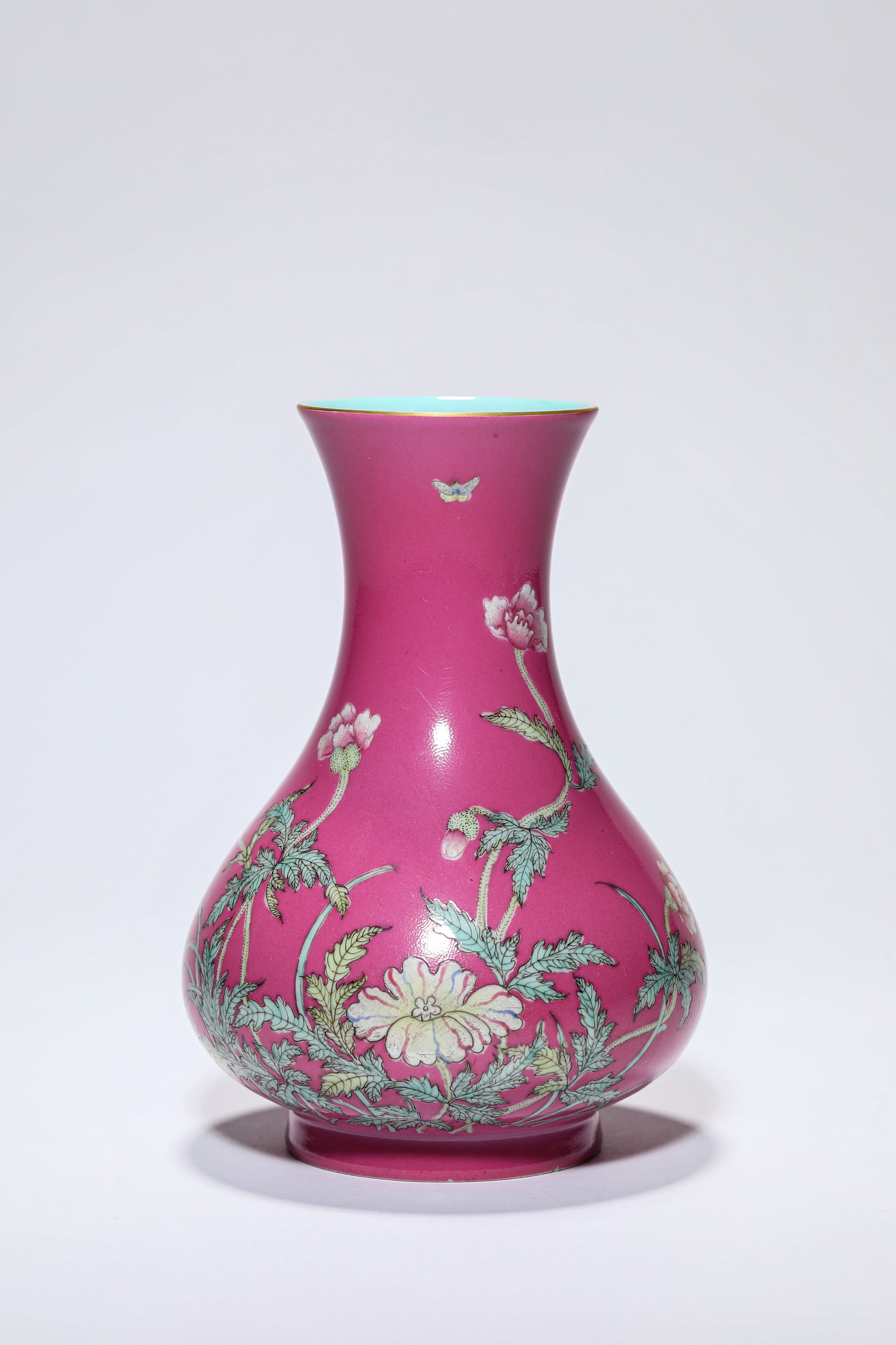A ROUGE-GROUND FAMILLE-ROSE ?FLORAL? VASE: A ROUGE-GROUND FAMILLE-ROSE ?FLORAL? VASE Description: Dimensions: Width: 11 cm x Height: 15.5 cm. All measurements are approximate.