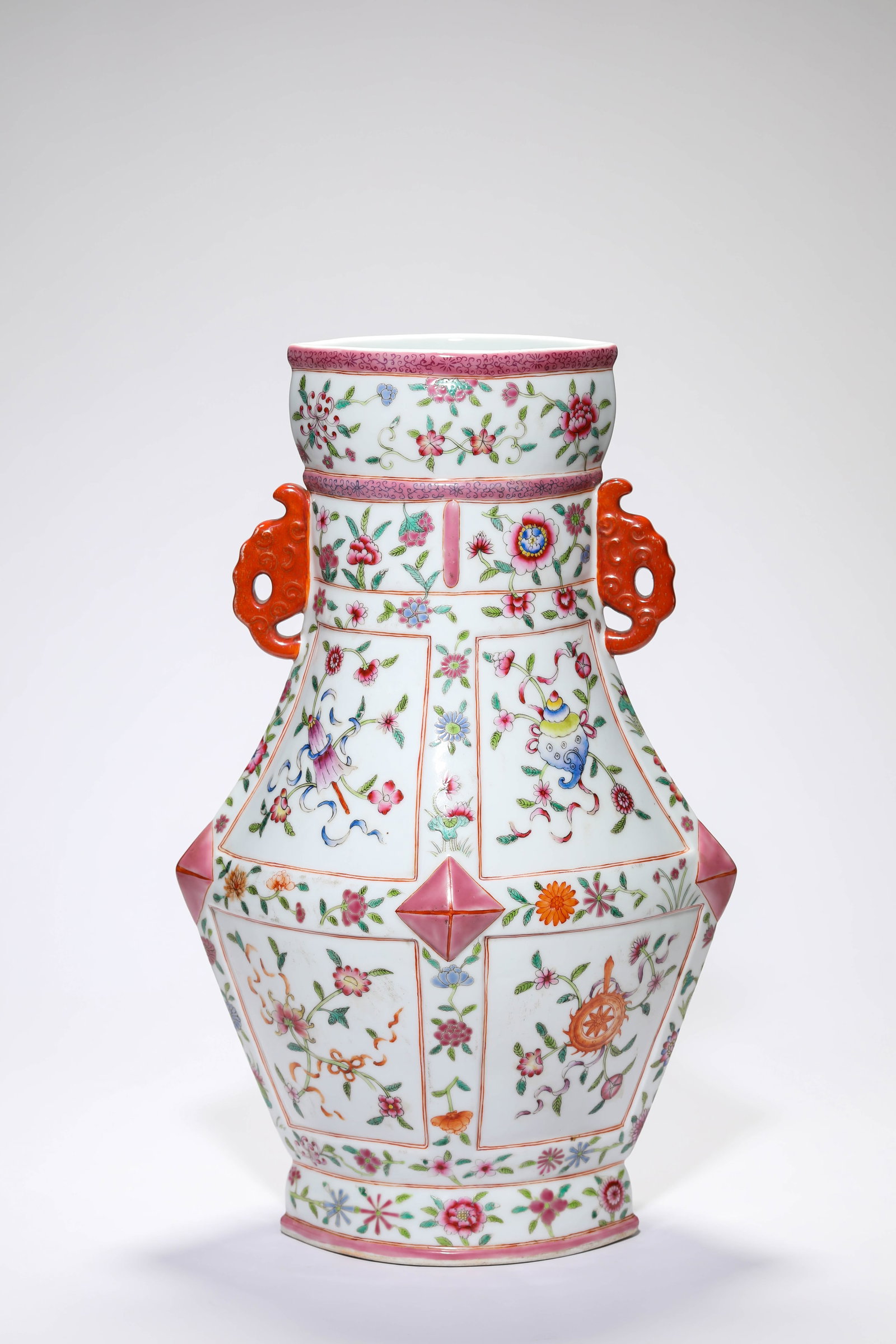 A FAMILLE-ROSE ?EIGHT BUDDHIST EMBLEMS? ?ELEPHANT-HEAD HANDLES? VASE (1 of 4)