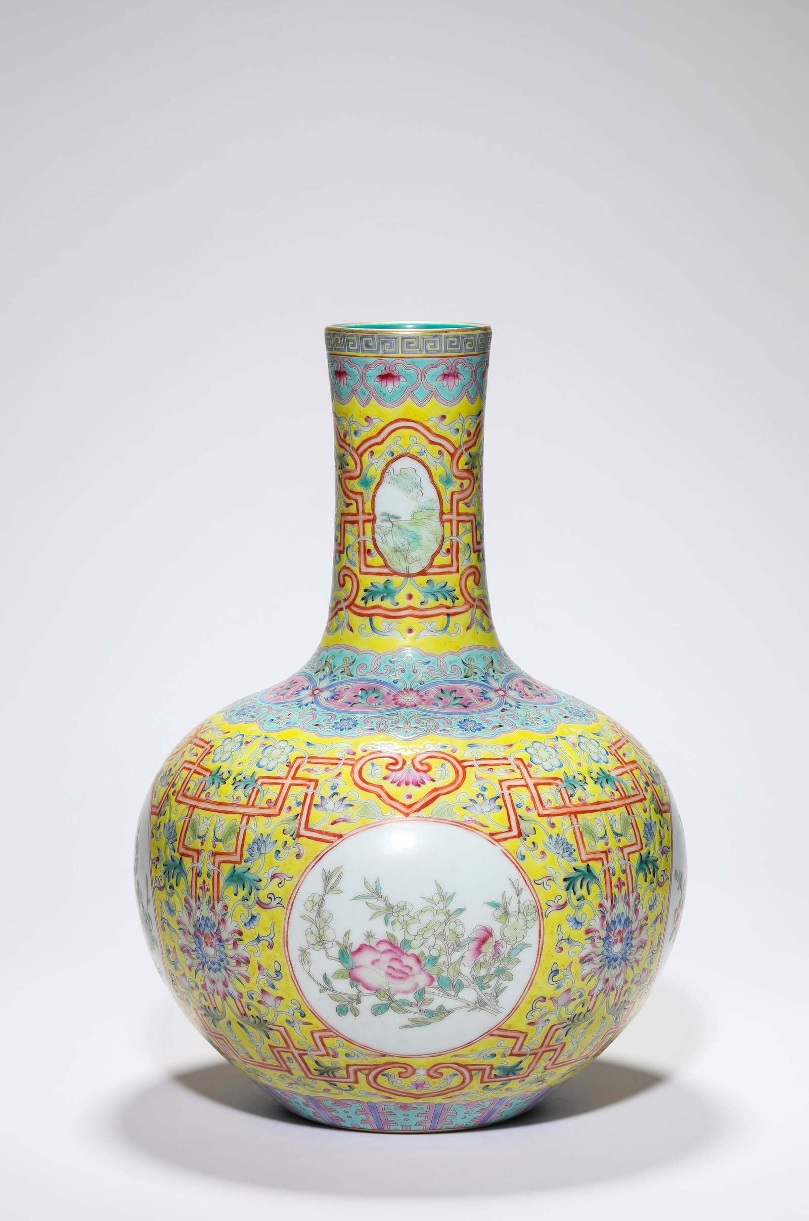 A YELLOW-GROUND FAMILLE-ROSE ?FLORAL RESERVES? SMALL CELESTIAL GLOBE VASE: A YELLOW-GROUND FAMILLE-ROSE ?FLORAL RESERVES? SMALL CELESTIAL GLOBE VASE Description: Dimensions: Width: 22.2 cm x Height: 33 cm. All measurements are approximate.
