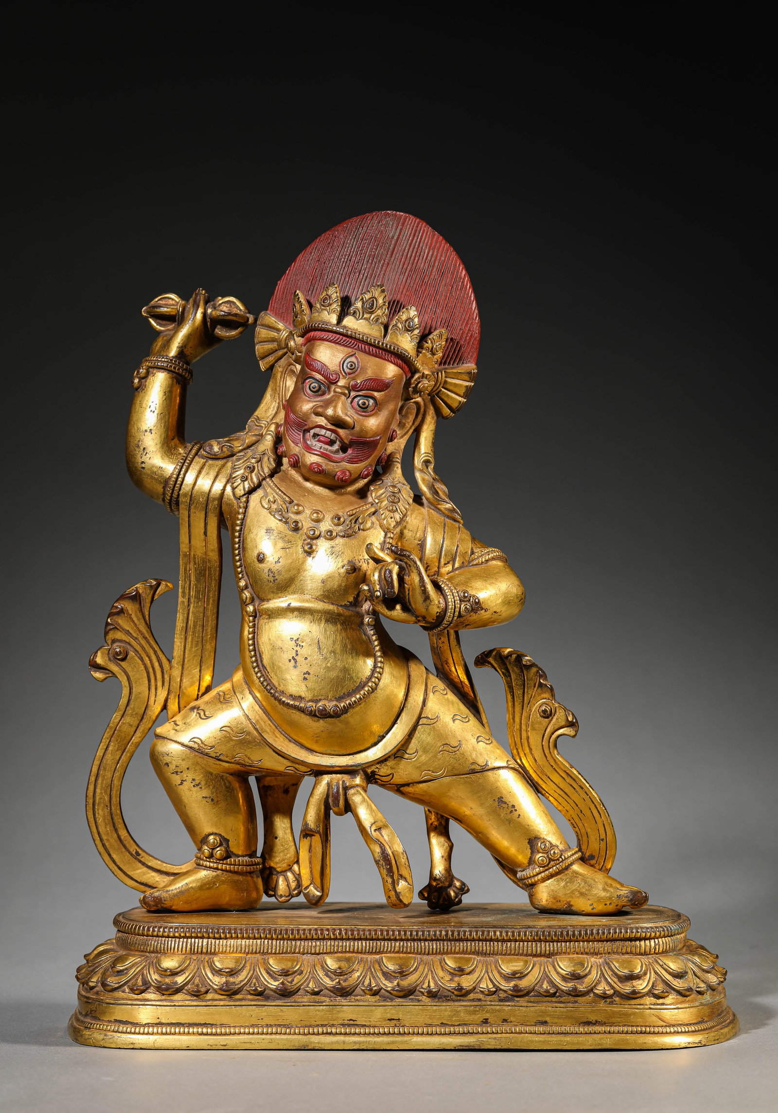 A GILT-BRONZE FIGURE OF MAHAKALA: A GILT-BRONZE FIGURE OF MAHAKALA Description: Dimensions: Weight: 7600 g. Length: 28.5 cm x Width: 14 cm x Height: 36.5 cm. All measurements are approximate.
