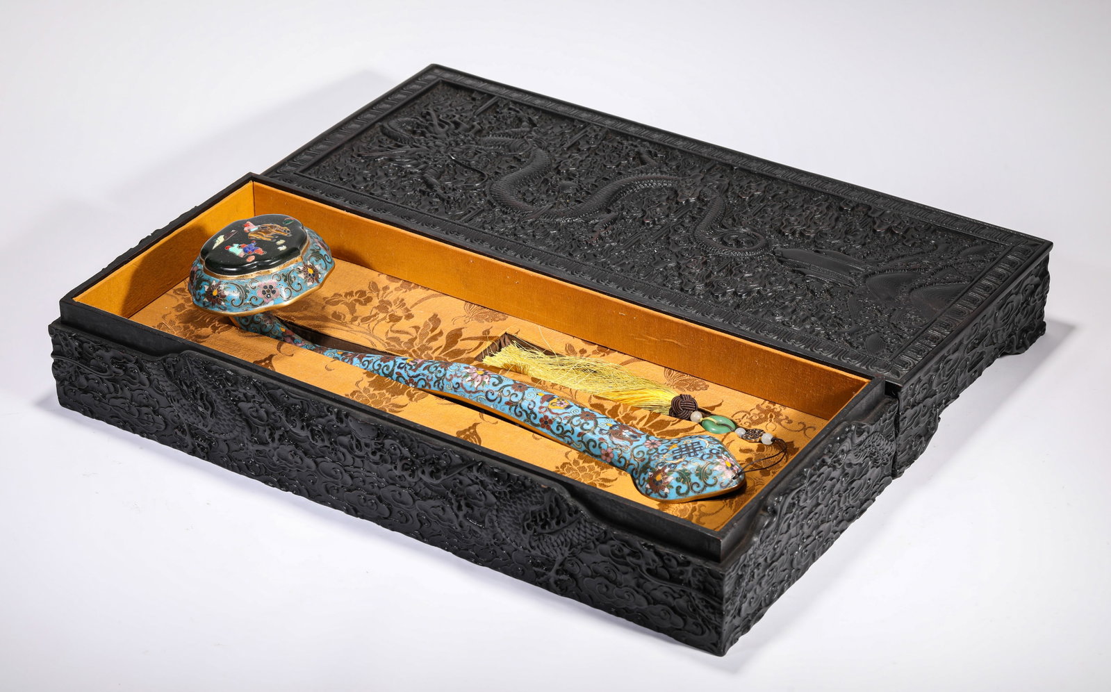 A CLOISONN‚ ENAMEL AND ?HUNDRED TREASURES?-INLAID RUYI SCEPTRE: A CLOISONN‚ ENAMEL AND ?HUNDRED TREASURES?-INLAID RUYI SCEPTRE Description: Dimensions: Weight: 1000 g. Length: 44 cm x Width: 11.5 cm x Height: 11 cm. All measurements are approximate.