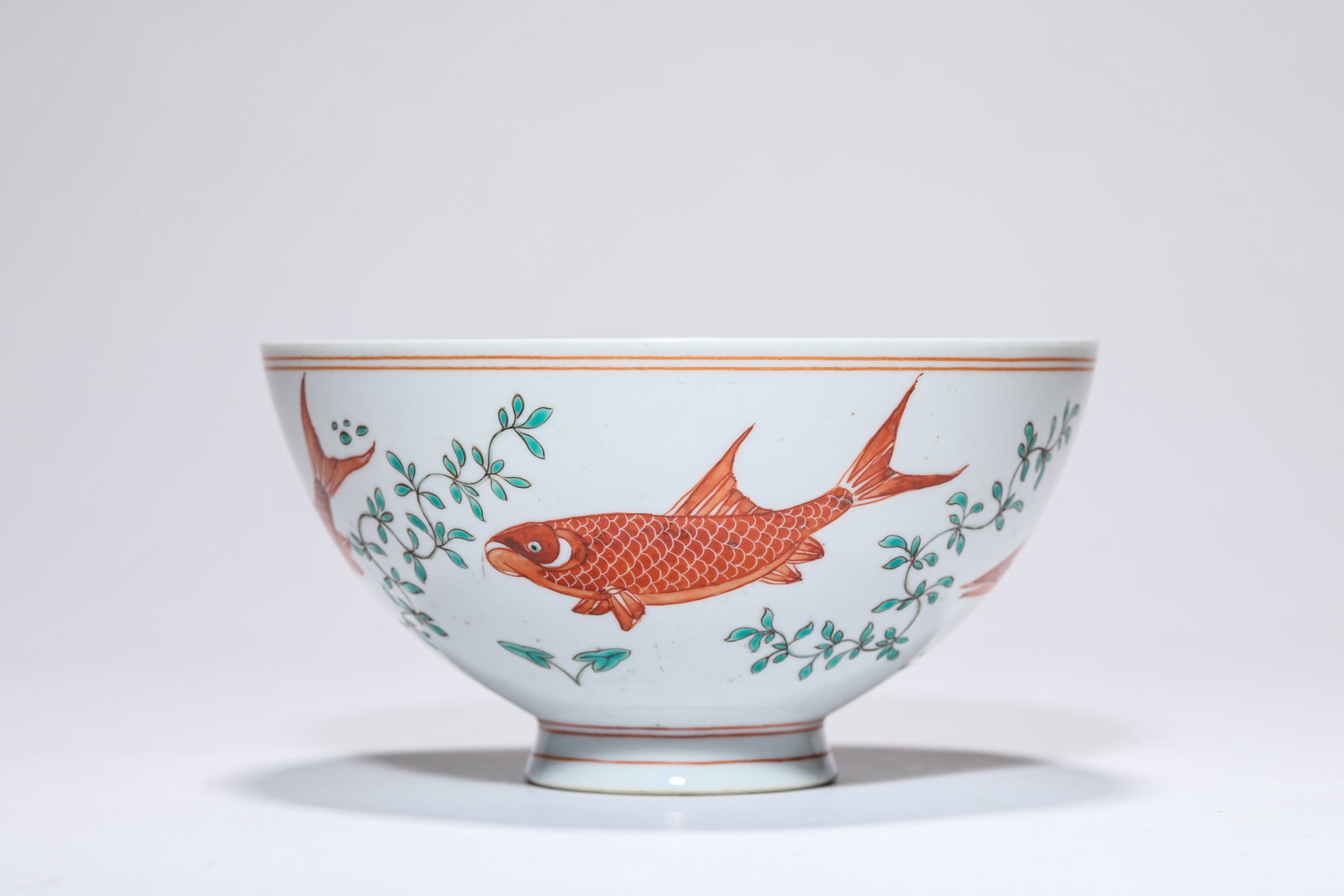 AN IRON-RED ?FISH? BOWL: AN IRON-RED ?FISH? BOWL Description: Dimensions: Width: 15.4 cm x Height: 8.2 cm. All measurements are approximate.