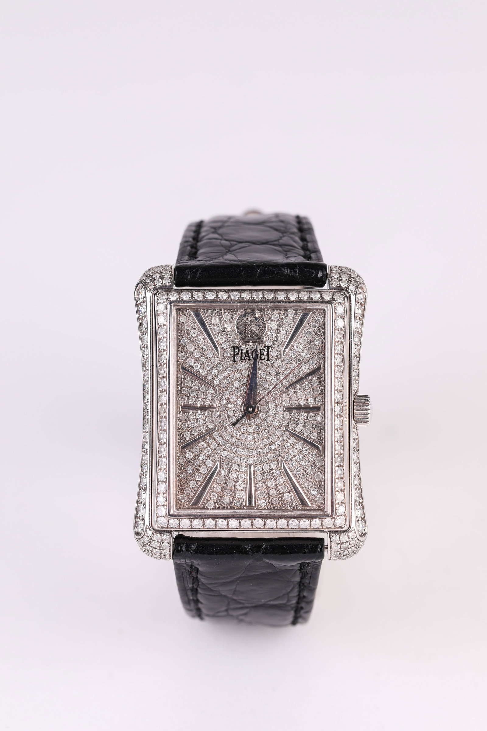 A PIAGET GOLD AND DIAMOND WRISTWATCH: A PIAGET GOLD AND DIAMOND WRISTWATCH Description: Dimensions: Width: 32 mm x Height: 33 mm. All measurements are approximate.