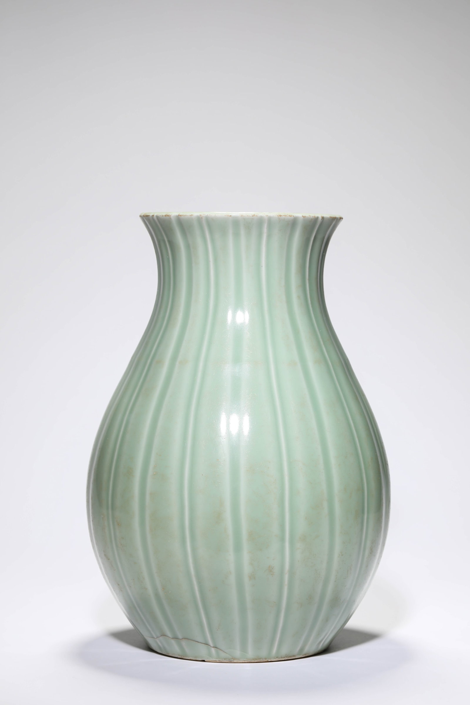 A BEAN-GREEN-GLAZED ?MELON-LOBED? VASE: A BEAN-GREEN-GLAZED ?MELON-LOBED? VASE Description: Dimensions: Width: 22.7 cm x Height: 32.4 cm. All measurements are approximate.