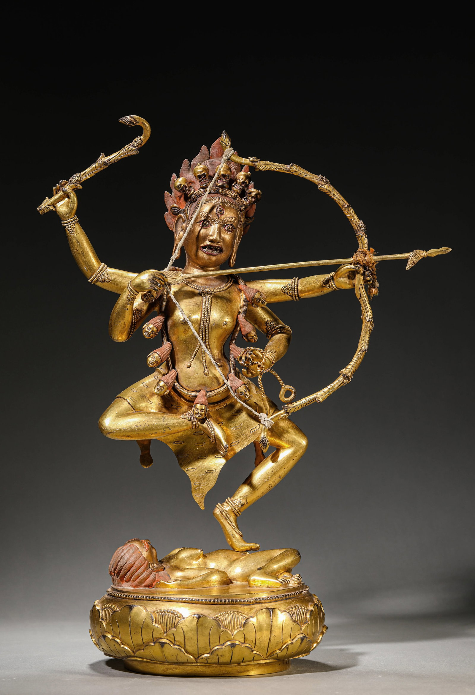 A GILT-BRONZE FIGURE OF JNANADAKINI: A GILT-BRONZE FIGURE OF JNANADAKINI Description: Dimensions: Weight: 6520 g. Length: 34.5 cm x Width: 19 cm x Height: 48 cm. All measurements are approximate.