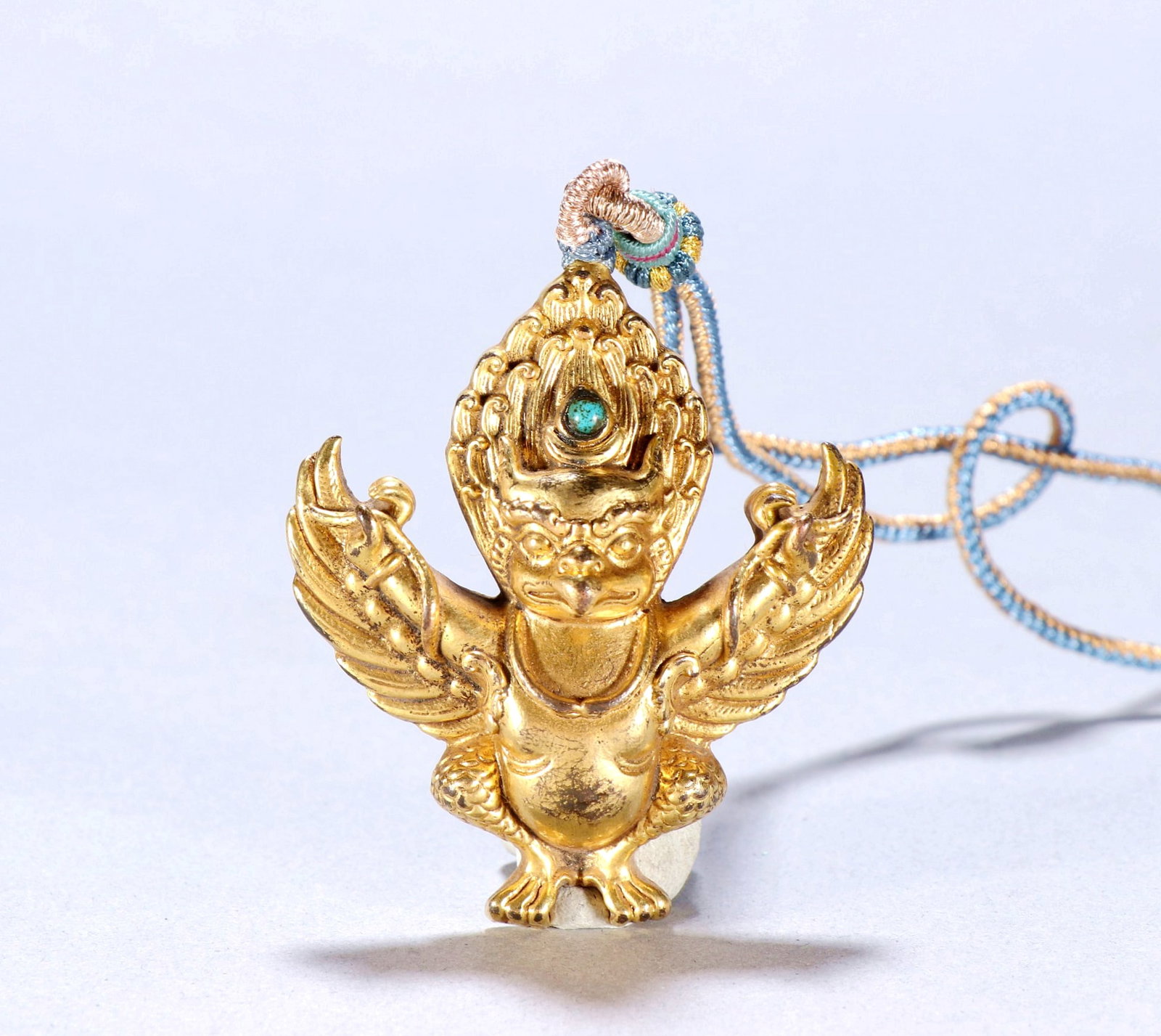 A GILT-BRONZE PENDANT OF GARUDA (1 of 8)