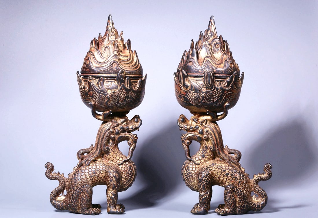 A PAIR OF GILT-LACQUERED BRONZE 'QILIN' BOSHAN CENSERS (1 of 11)