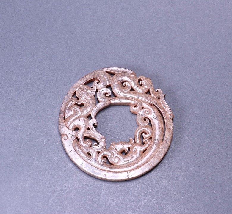 A JADE RING IN DRAGON FORM: A JADE RING IN DRAGON FORM Size:Diam:8.2cm