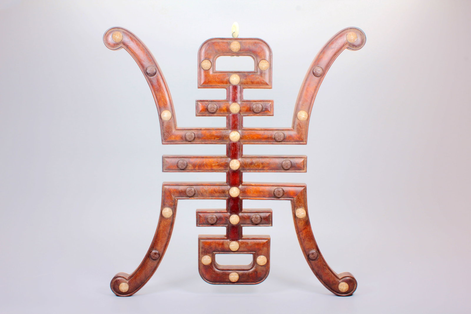 A HUANGHUALI HANGING PANEL INLAID WITH JADE 'SHOU' CHARACTERS: A HUANGHUALI HANGING PANEL INLAID WITH JADE 'SHOU' CHARACTERS Size:Length:40.4cm,Width:37.5cm