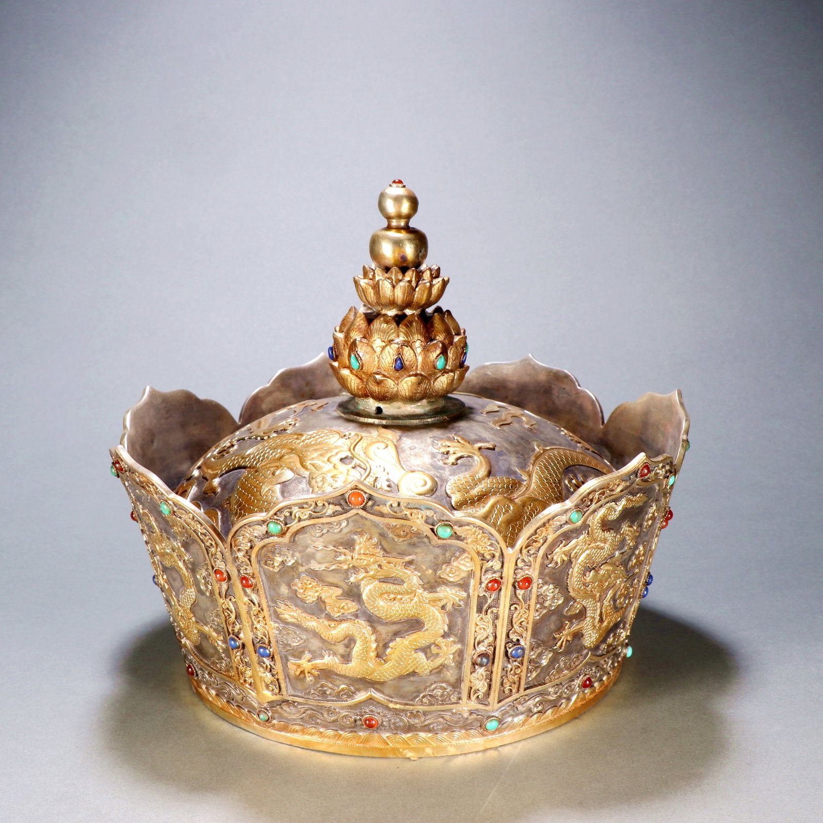 A GILT-BRONZE AND SILVER-GILT OFFICIAL HAT WITH DRAGON MOTIFS: A GILT-BRONZE AND SILVER-GILT OFFICIAL HAT WITH DRAGON MOTIFS Size:Height:21.2cm,Width:24cm;Weight:2700grams