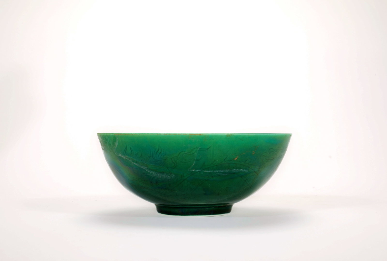A GREEN GLAZED ANHUA DRAGON BOWL: A GREEN GLAZED ANHUA DRAGON BOWL Size:Width:12cm,Height:5cm