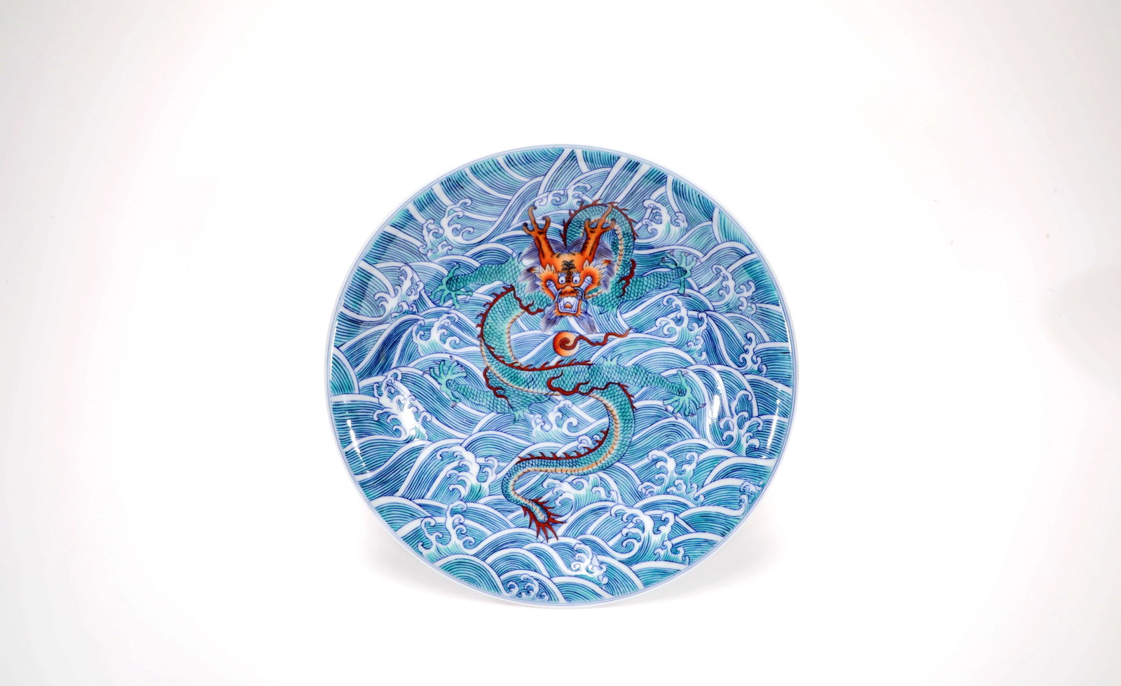 A DOUCAI SEAWATER DRAGON DISH: A DOUCAI SEAWATER DRAGON DISH Size:Width:21cm,Height:3.2cm