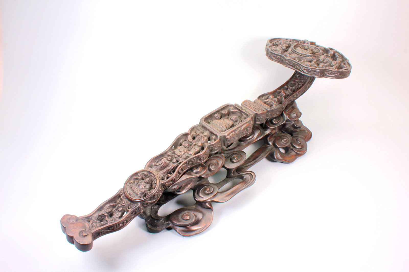 AN OPENWORK AGARWOOD 'RUYI' SCEPTER WITH BUDDHIST FIGURES: AN OPENWORK AGARWOOD 'RUYI' SCEPTER WITH BUDDHIST FIGURES Size:Height:21cm,Length:66cm,Width:15.5cm