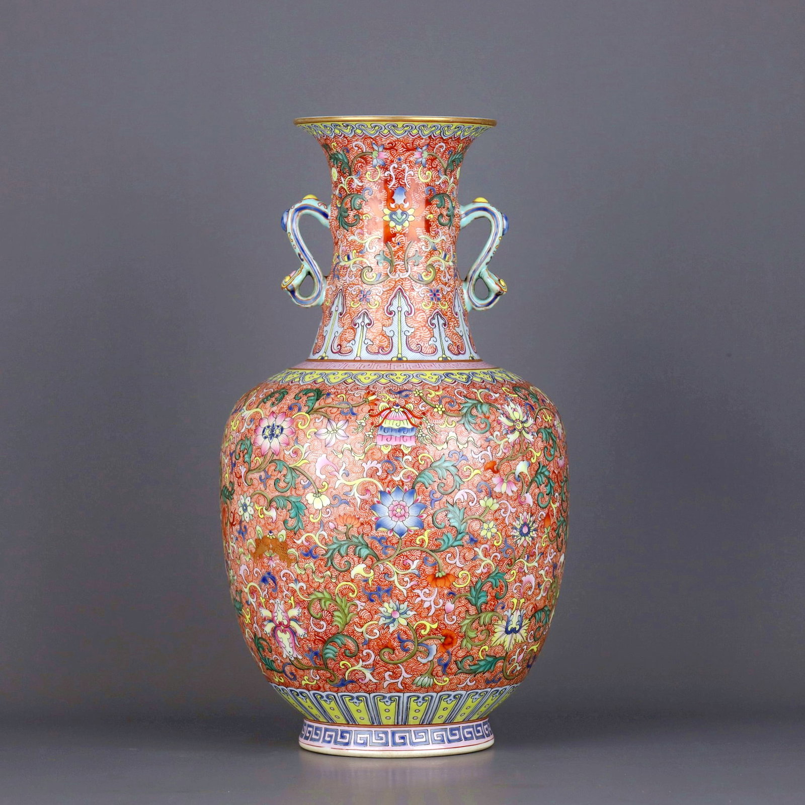 A IRON-RED PHOENIX FAMILLE-ROSE EIGHT TREASURES RUYI-EAR VASE: A IRON-RED PHOENIX FAMILLE-ROSE EIGHT TREASURES RUYI-EAR VASE Size:Height:34.5cm,Diam:19.8cm