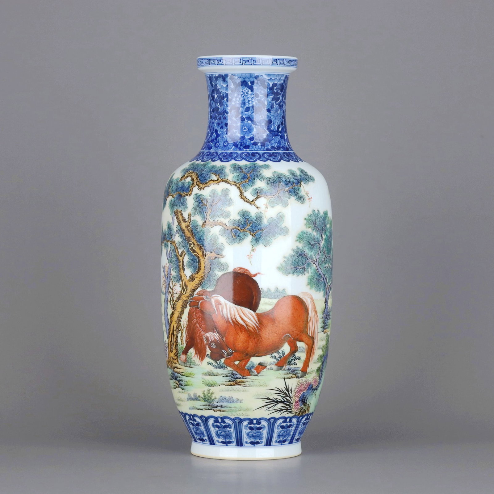 A BLUE AND WHITE AND FAMILLE-ROSE HORSE AND PINE CLUB-SHAPED VASE: A BLUE AND WHITE AND FAMILLE-ROSE HORSE AND PINE CLUB-SHAPED VASE Size:Height:32.2cm,Diam:14cm