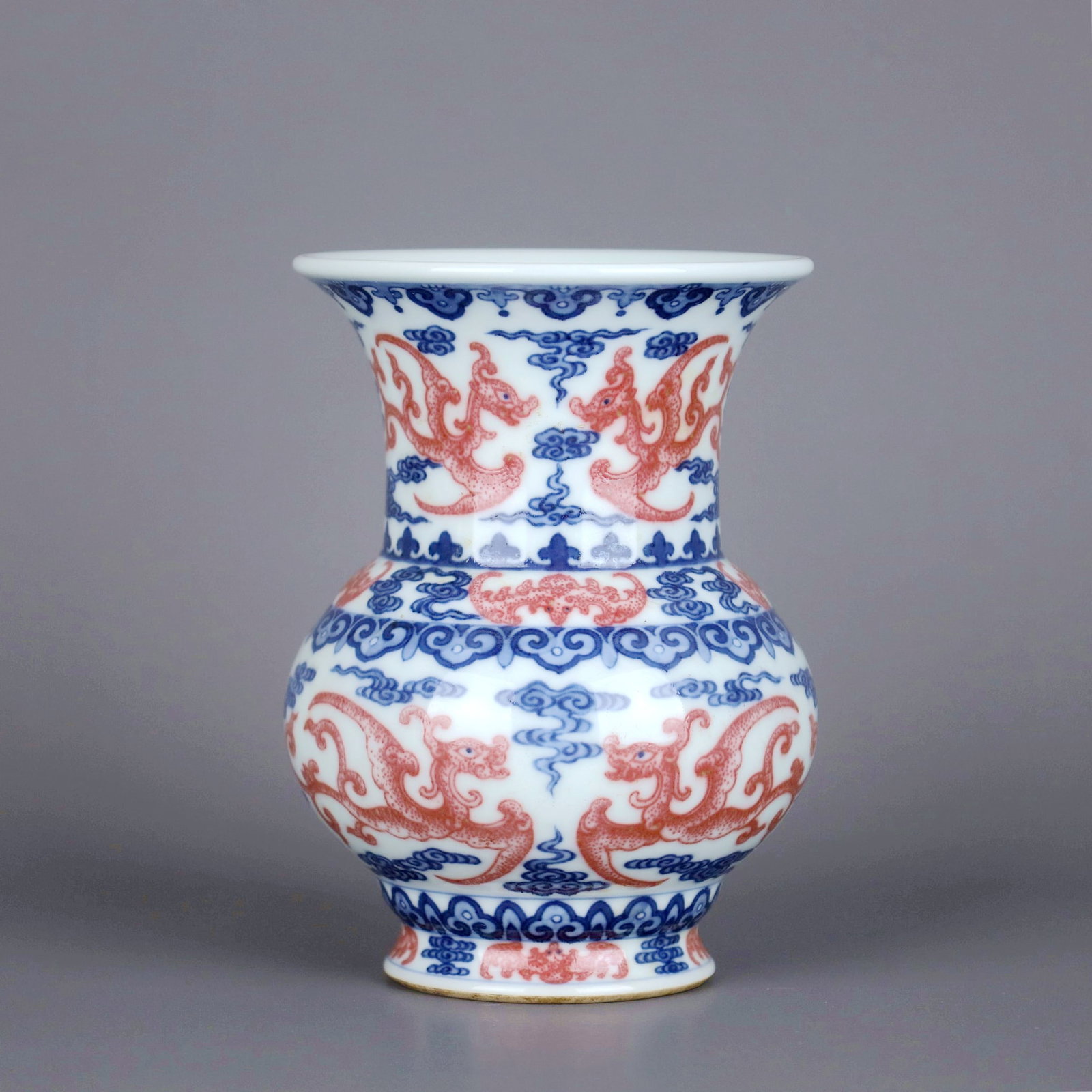A BLUE AND WHITE COPPER-RED BAT AND DRAGON VASE,ZUN: A BLUE AND WHITE COPPER-RED BAT AND DRAGON VASE,ZUN Size:Height:12.5cm,Diam:9cm