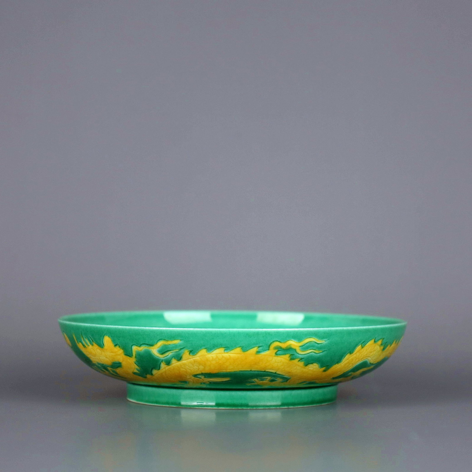 A GREEN GROUND YELLOW DRAGON DISH - 6