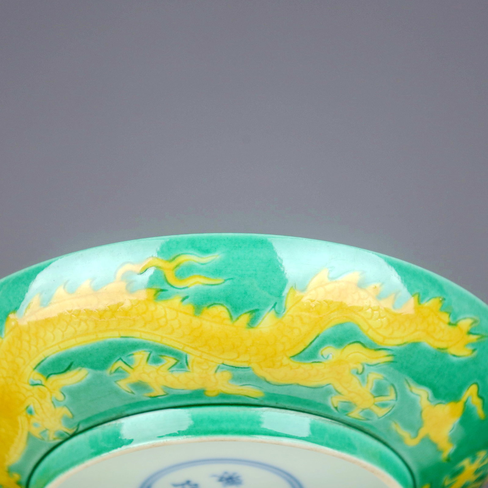 A GREEN GROUND YELLOW DRAGON DISH - 8