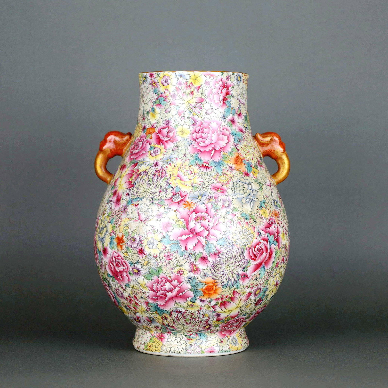 A FAMILLE-ROSE MILLE FLEURS ELEPHANT-EAR VASE,ZUN: A FAMILLE-ROSE MILLE FLEURS ELEPHANT-EAR VASE,ZUN Size:Height:31.7cm,Diam:23cm