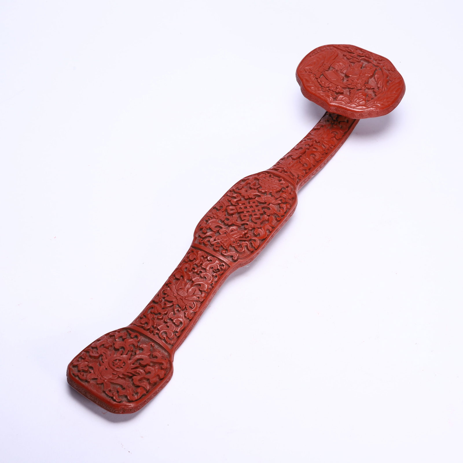 A CHINESE CARVED CINNABAR LACQUER RUYI SCEPTER: A CHINESE CARVED CINNABAR LACQUER RUYI SCEPTER (40 x 9.5cm,Weight 330g)