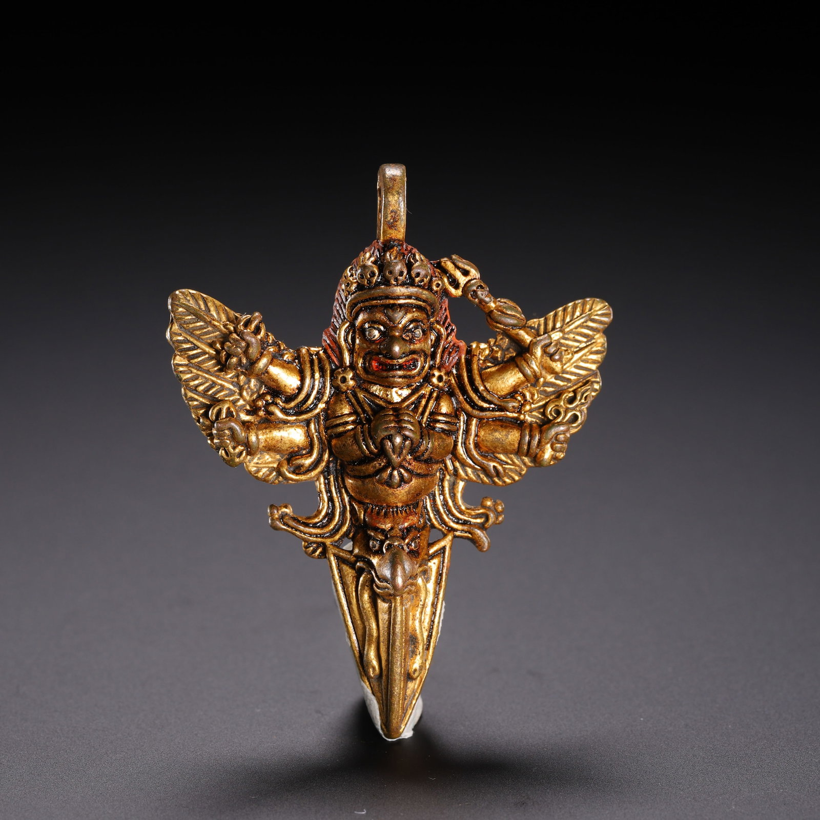 A CHINESE GILT BRONZE GARUDA PHURBA AMULET (1 of 9)