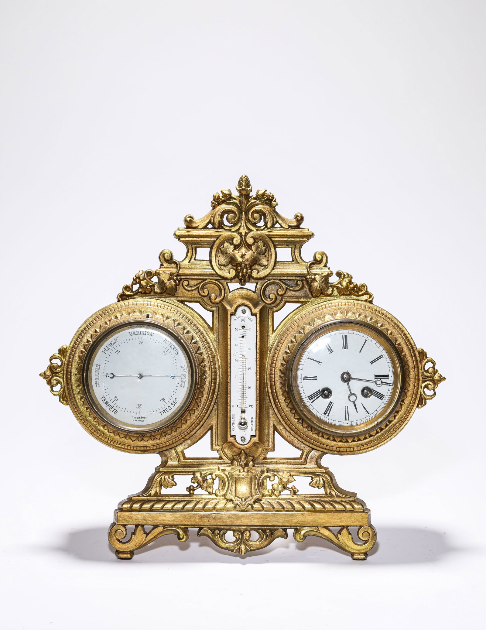 A GILT-BRONZE 'DOUBLE-TRAIN' MANTEL CLOCK: A GILT-BRONZE 'DOUBLE-TRAIN' MANTEL CLOCK Description: Dimensions: Weight: 3600 g. Length: 37.5 cm x Width: 16 cm x Height: 35 cm. All measurements are approximate.