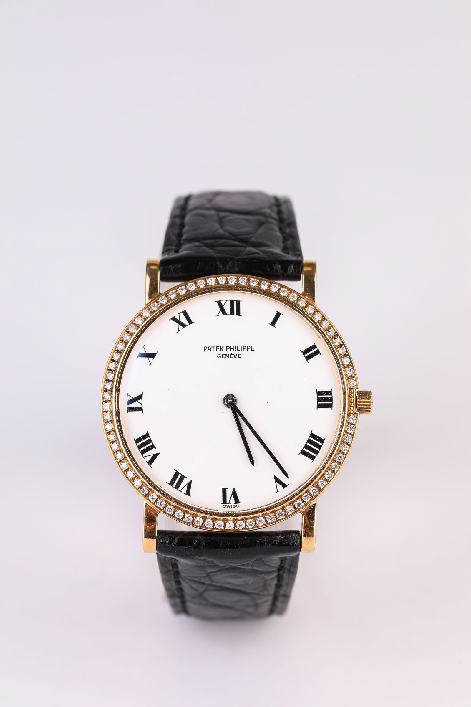 A PATEK PHILIPPE GOLD AND DIAMOND WRISTWATCH: A PATEK PHILIPPE GOLD AND DIAMOND WRISTWATCH Description: Dimensions: Width: 34 mm. All measurements are approximate.