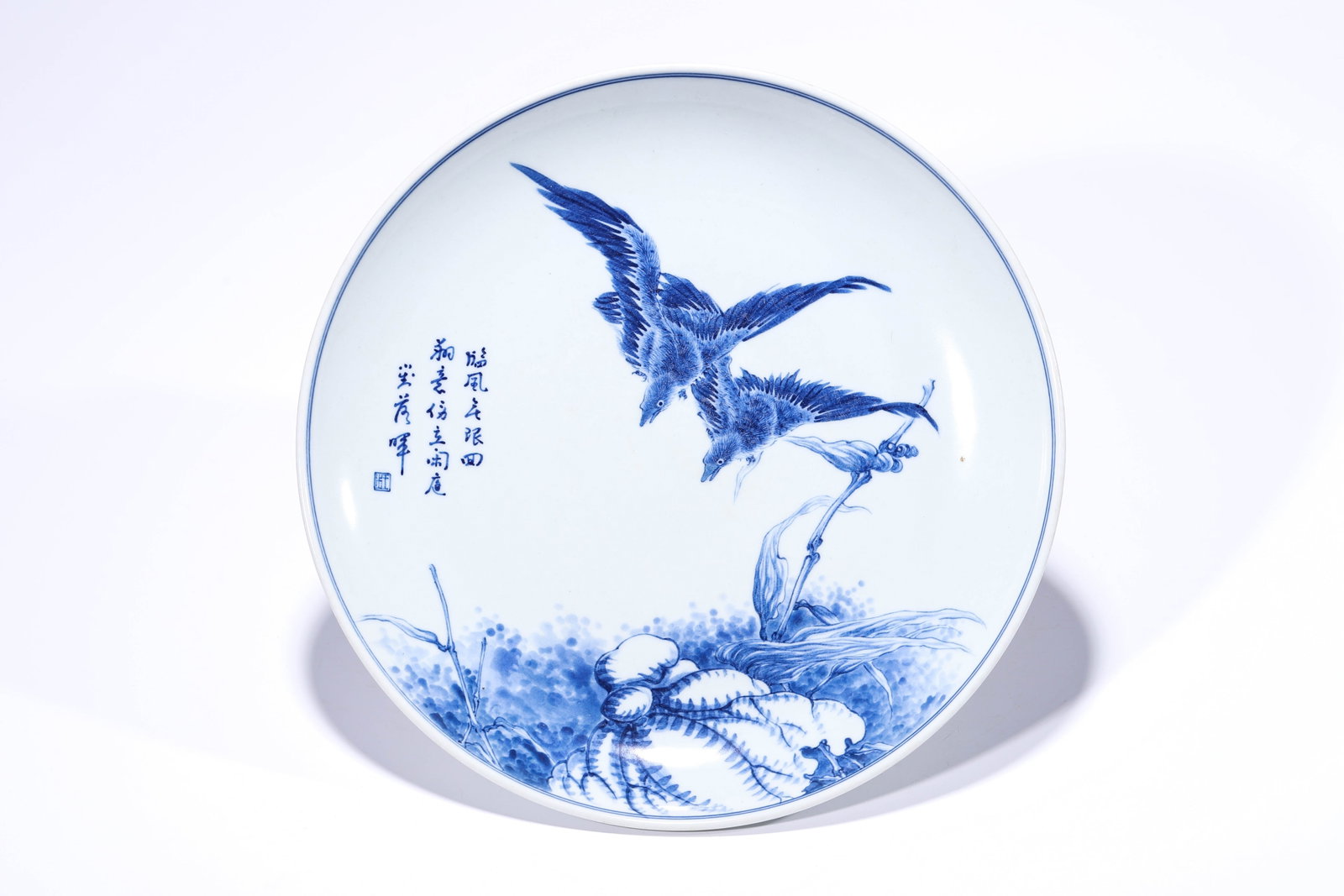 A BLUE AND WHITE 'FLOWERS, BIRDS AND POEM' DISH: A BLUE AND WHITE 'FLOWERS, BIRDS AND POEM' DISH Description: Dimensions: Width: 30.5 cm x Height: 4.8 cm. All measurements are approximate.