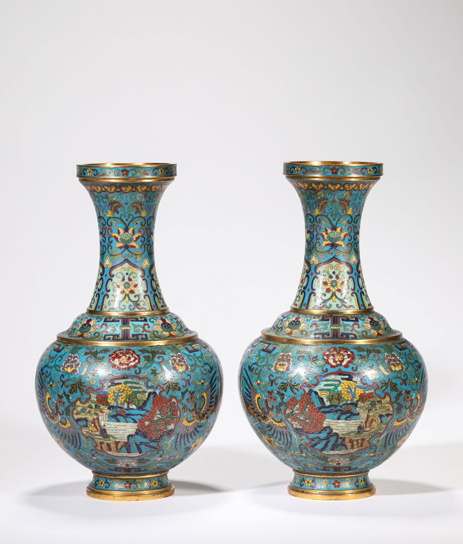 A PAIR OF CLOISONNE ENAMEL 'LANDSCAPE AND PHOENIX' VASES: A PAIR OF CLOISONNE ENAMEL 'LANDSCAPE AND PHOENIX' VASES Description: Dimensions: Weight: 2300 g. Width: 16.5 cm x Height: 29 cm. All measurements are approximate.