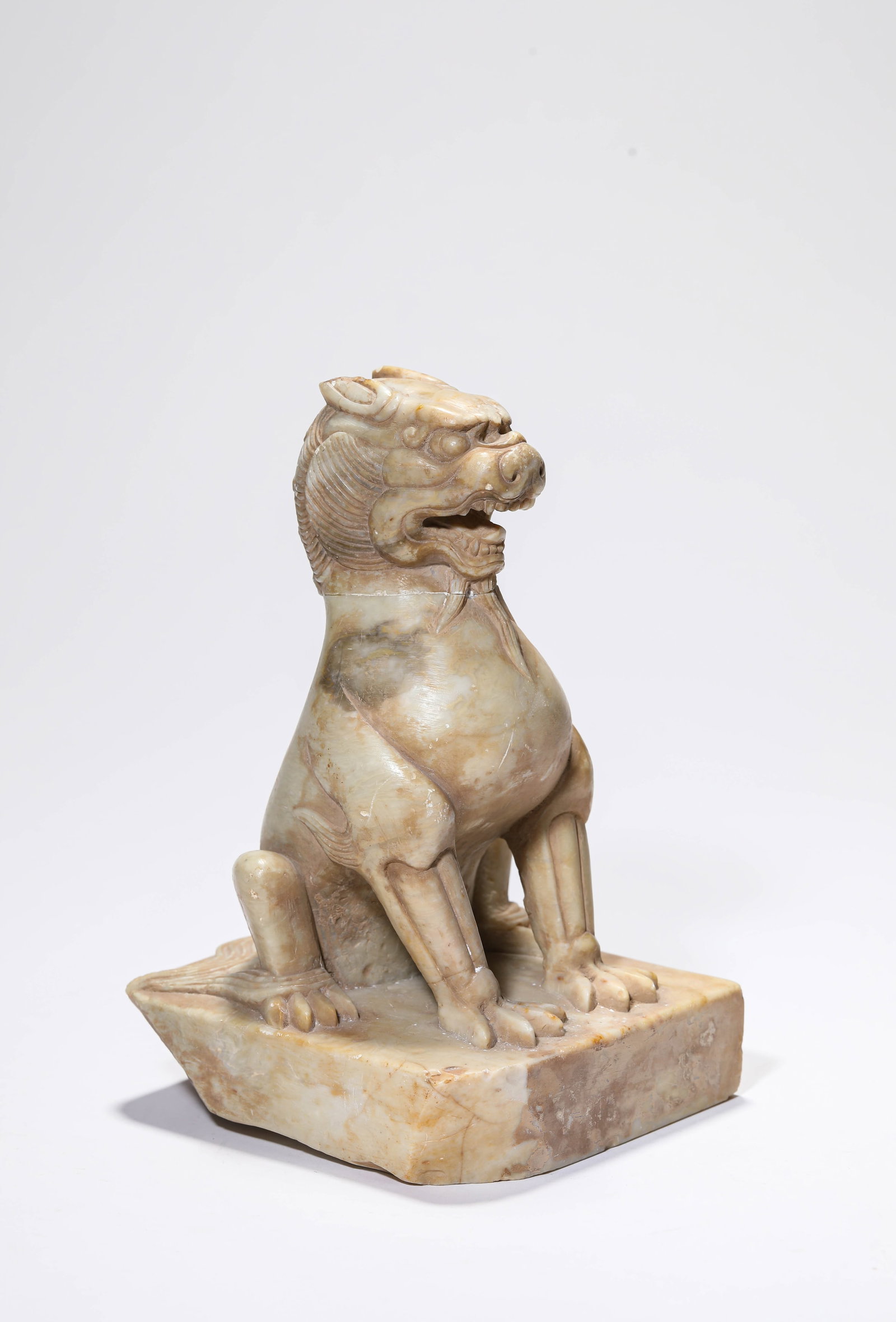 A WHITE MARBLE 'CARVED AUSPICIOUS BEAST': A WHITE MARBLE 'CARVED AUSPICIOUS BEAST' Description: Dimensions: Length: 12.3 cm x Width: 11.6 cm x Height: 19.2 cm. All measurements are approximate.